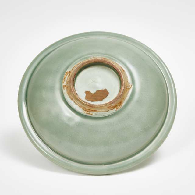 A Longquan Celadon Carved Charger, Ming Dynasty 