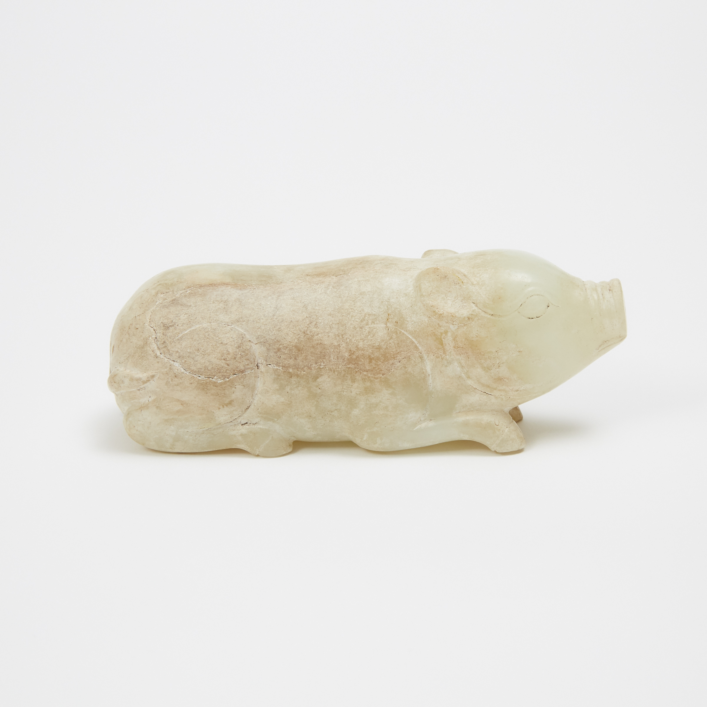 A White and Russet Jade Carving of a Pig