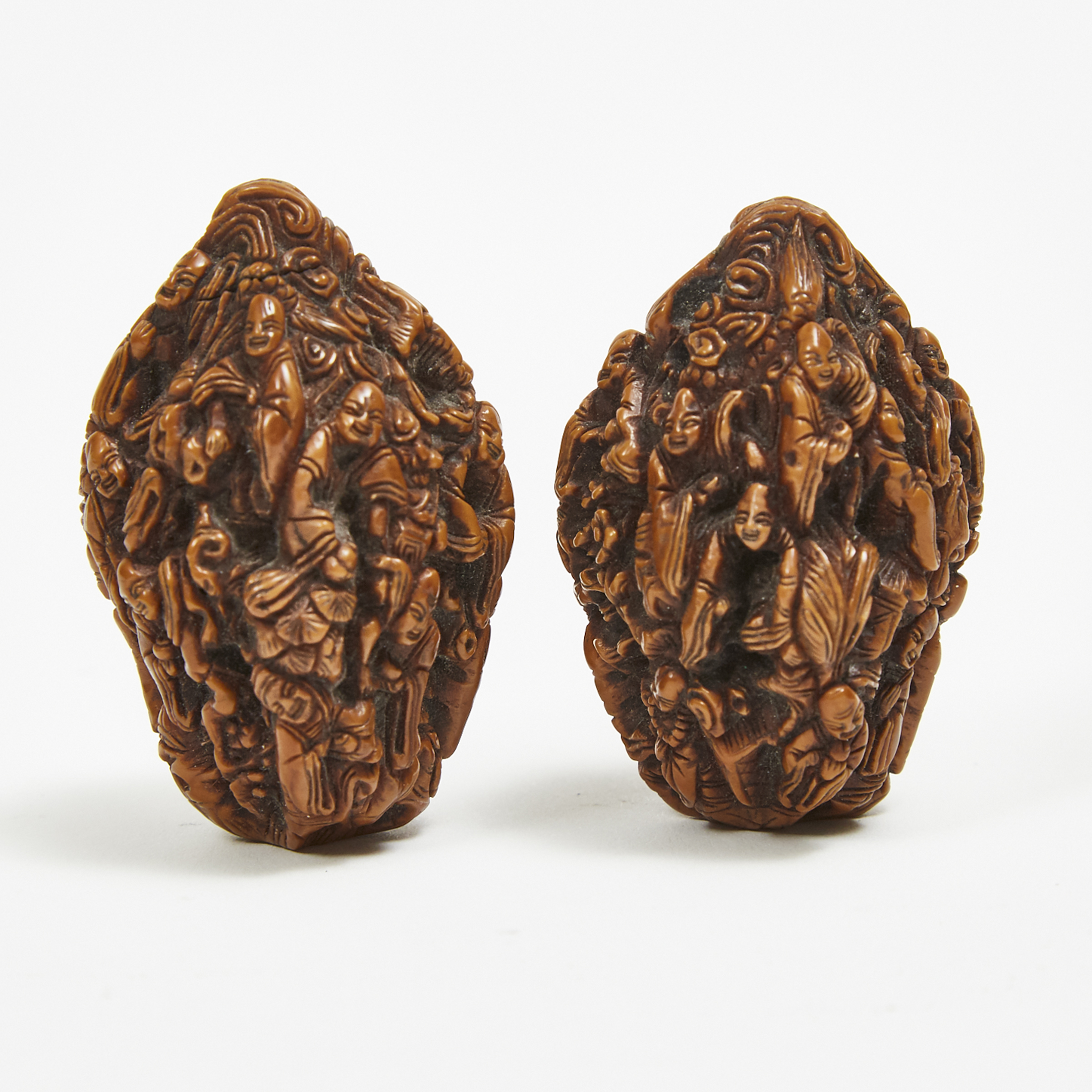 A Pair of 'Eighteen Luohans' Carved Walnuts, Qing Dynasty