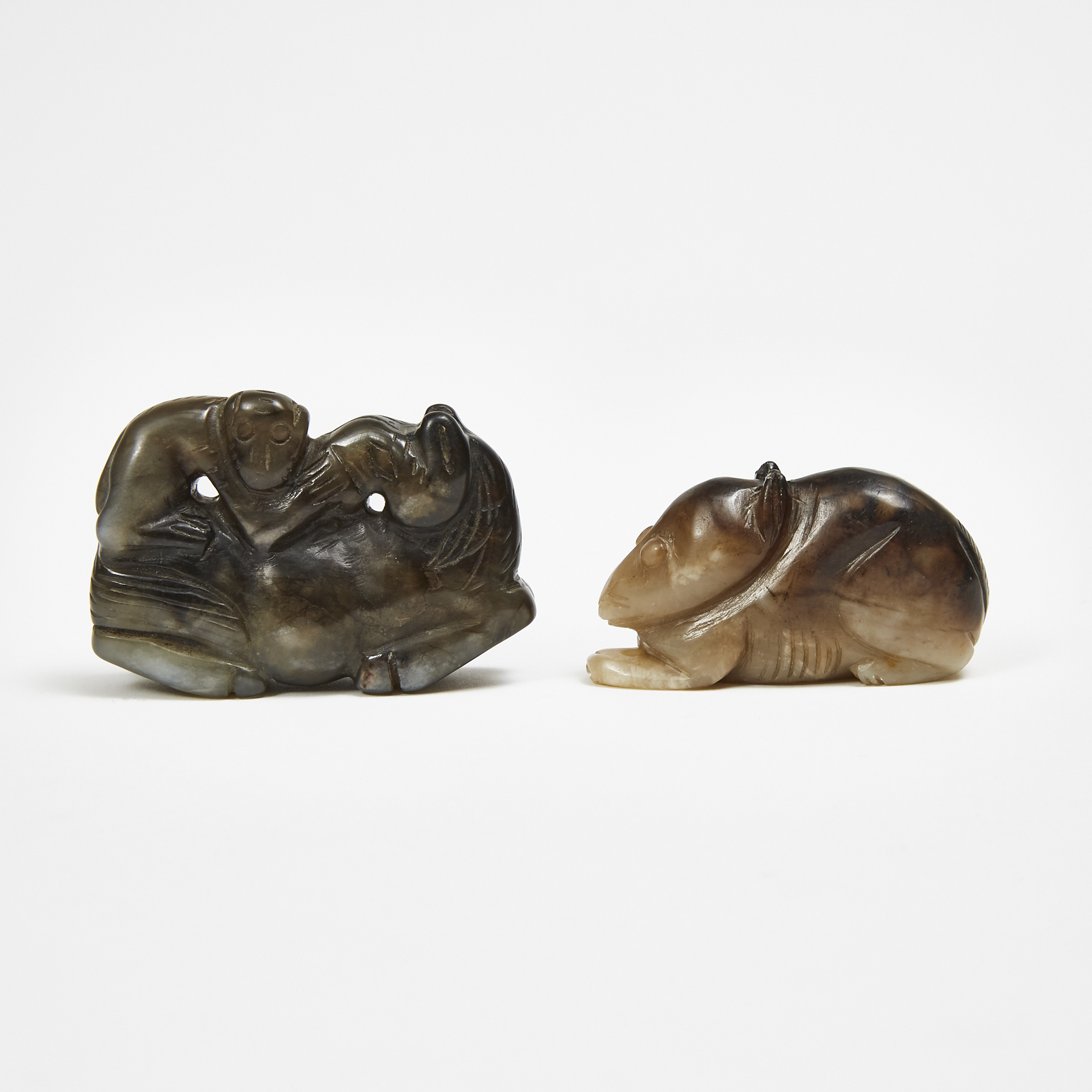 A Black and Russet Jade Carving of Monkey and Horse Group, together with a Black and Russet Jade Carving of a Rabbit