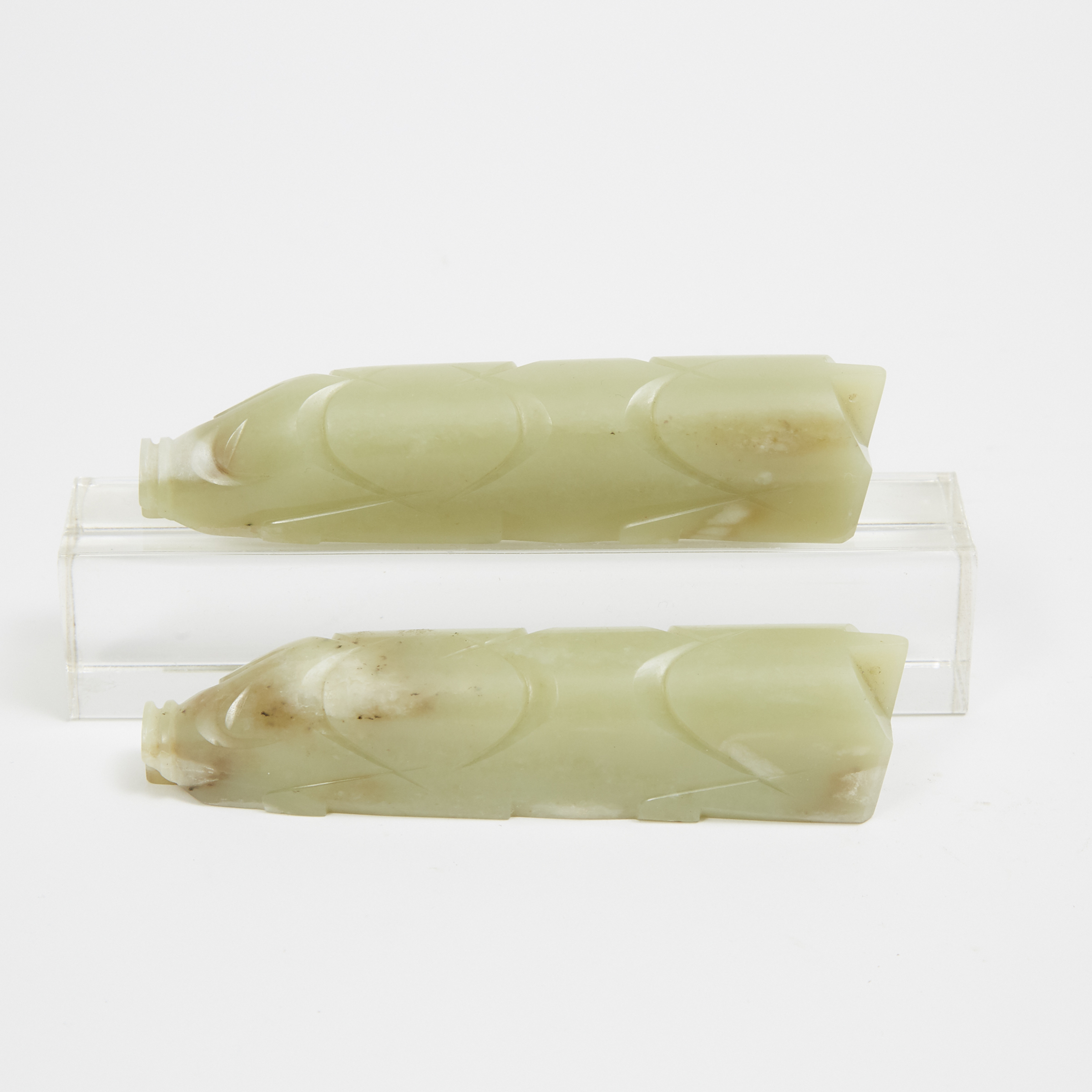 Two Archaic-Style Celadon Jade Carvings of Pigs