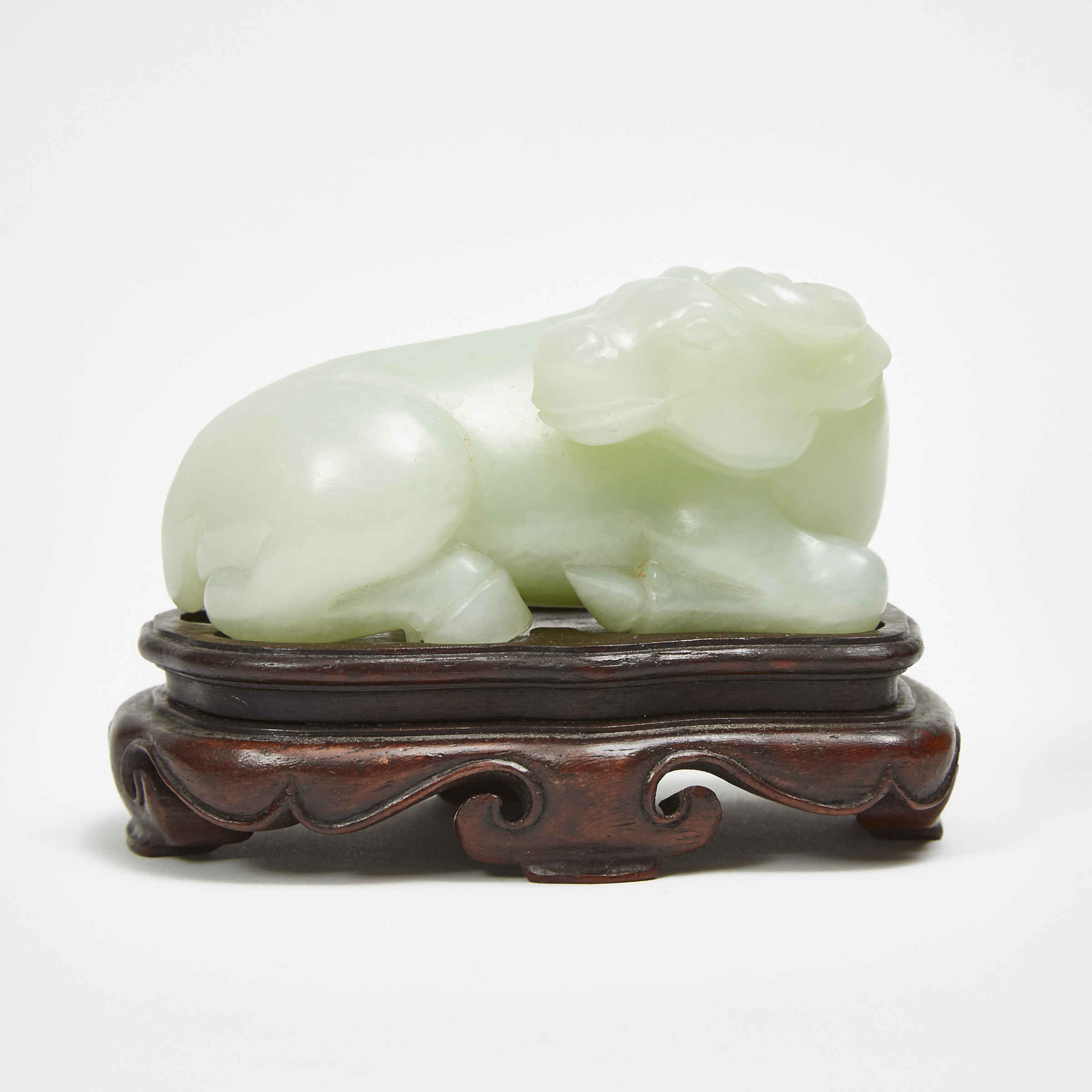 A Celadon White Jade Carving of a Recumbent Buffalo