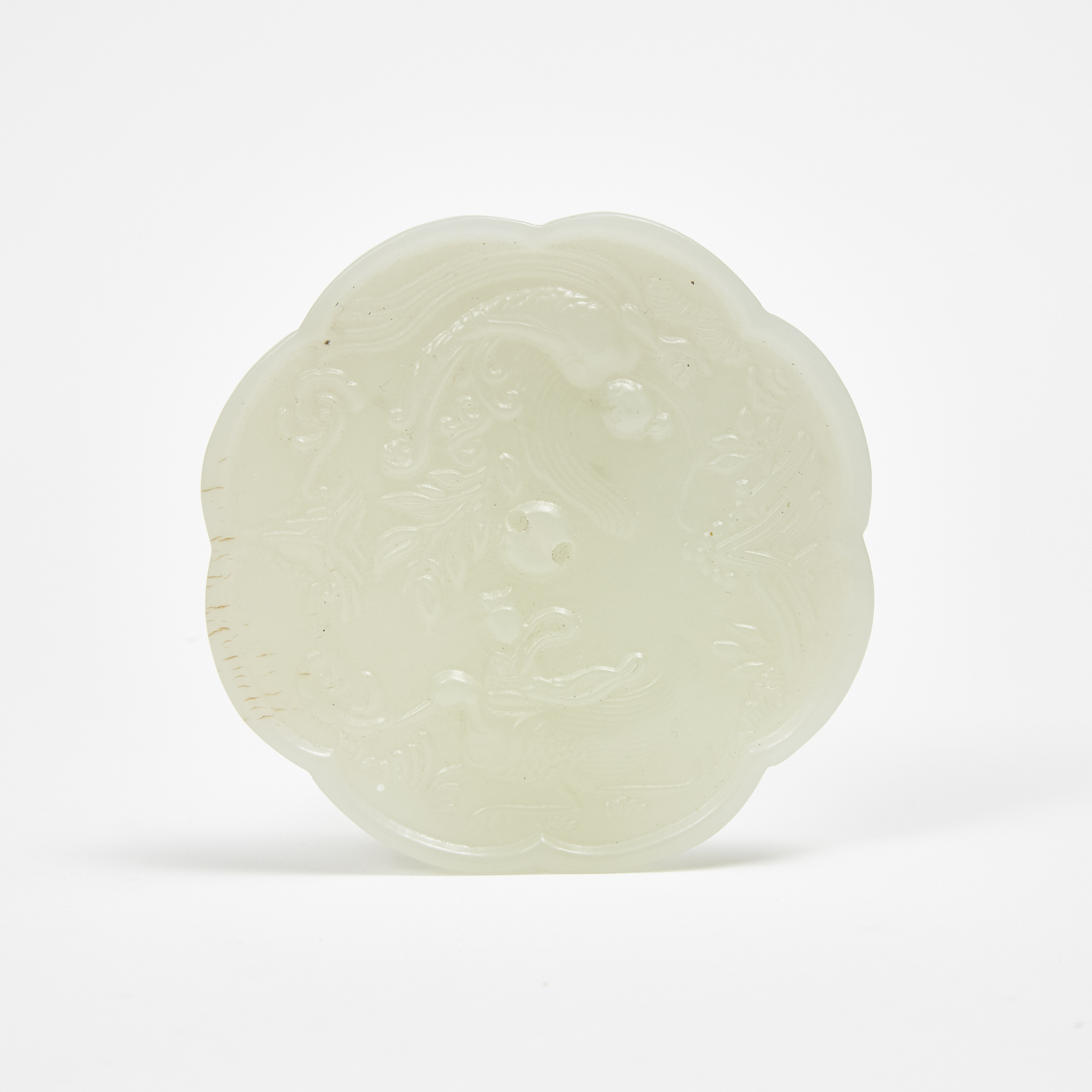 A Small Tang-Style White Jade Mirror-Form Carving