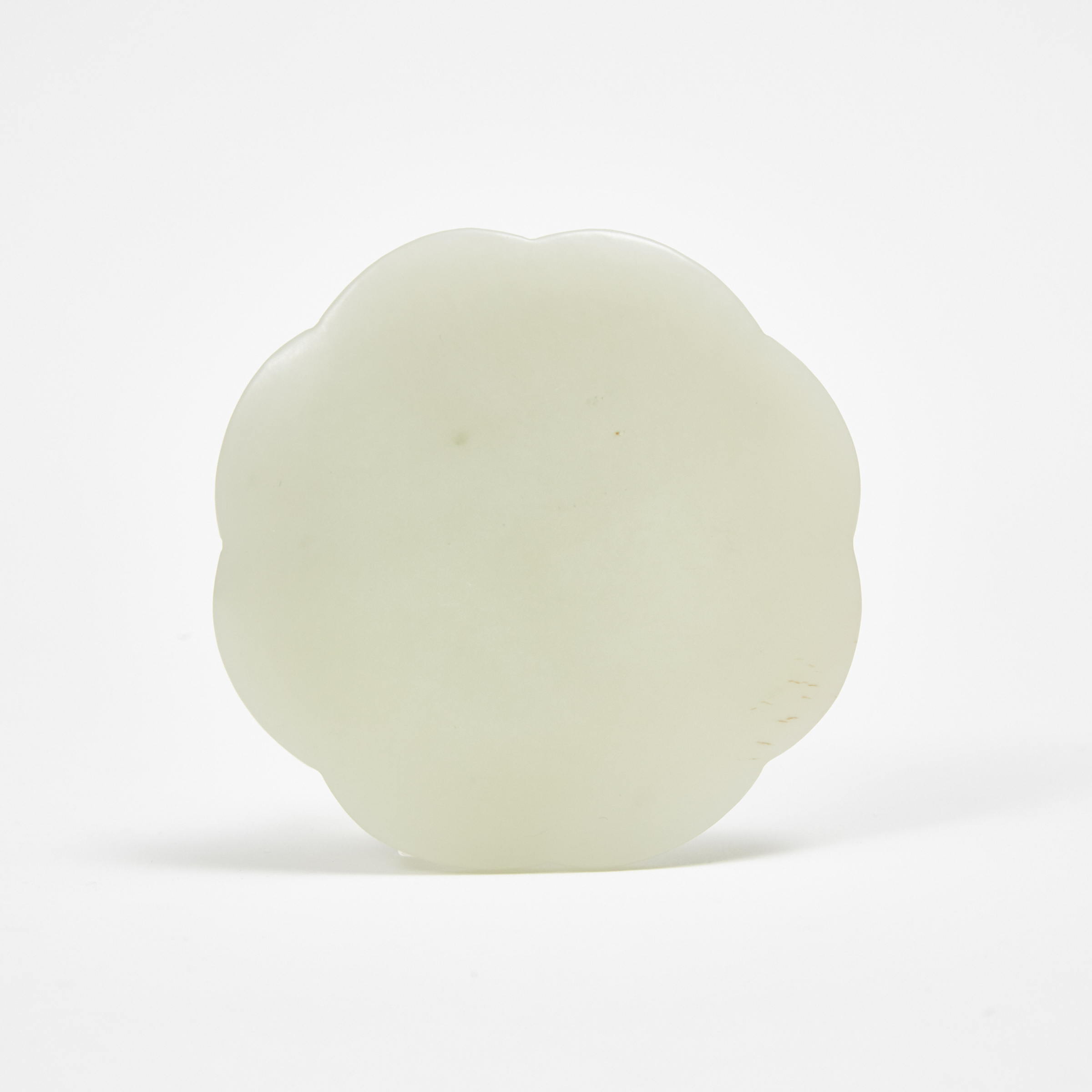 A Small Tang-Style White Jade Mirror-Form Carving
