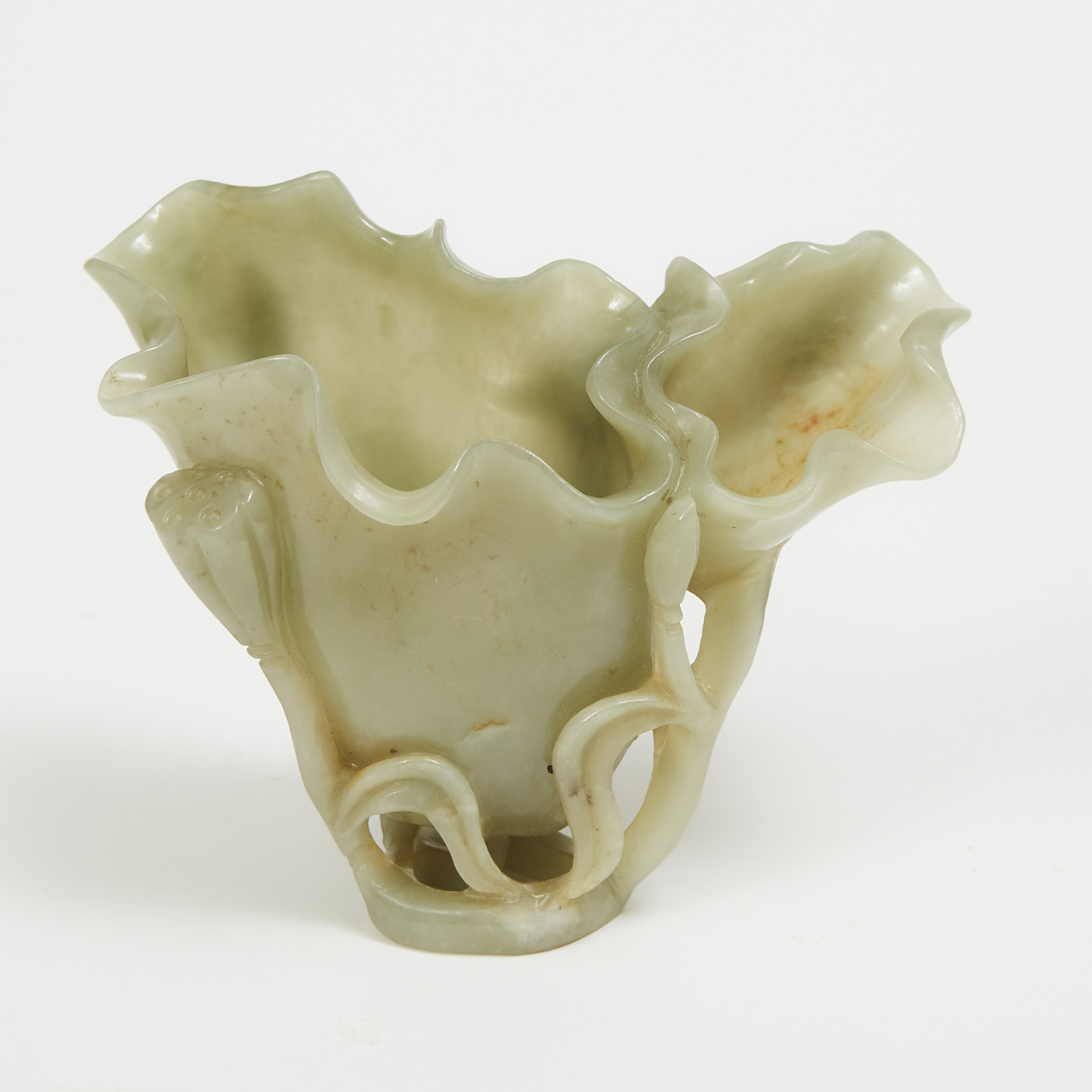 A Carved Celadon and Russet Jade 'Lotus Flower' Libation Cup