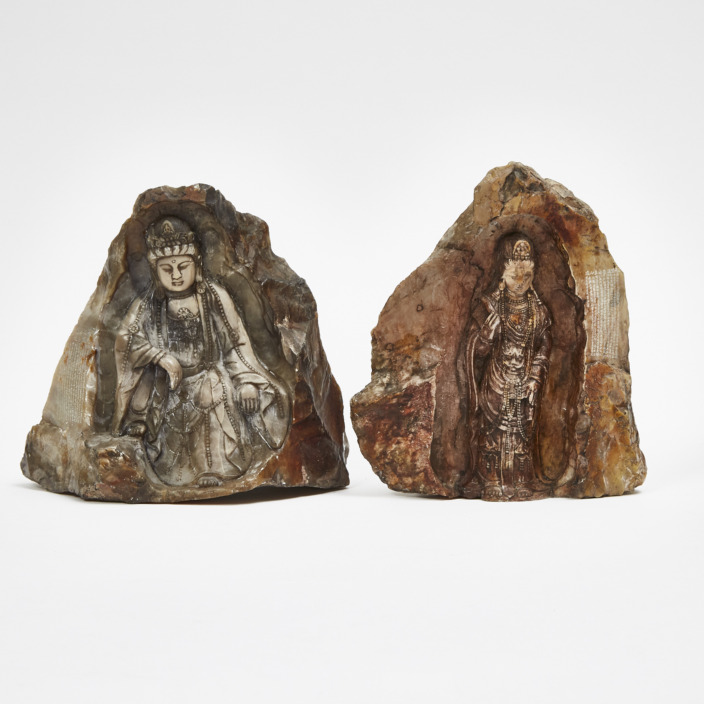 Two Soapstone Boulders of Guanyin Carved in Relief, together with an Ivorine Carved Gourd