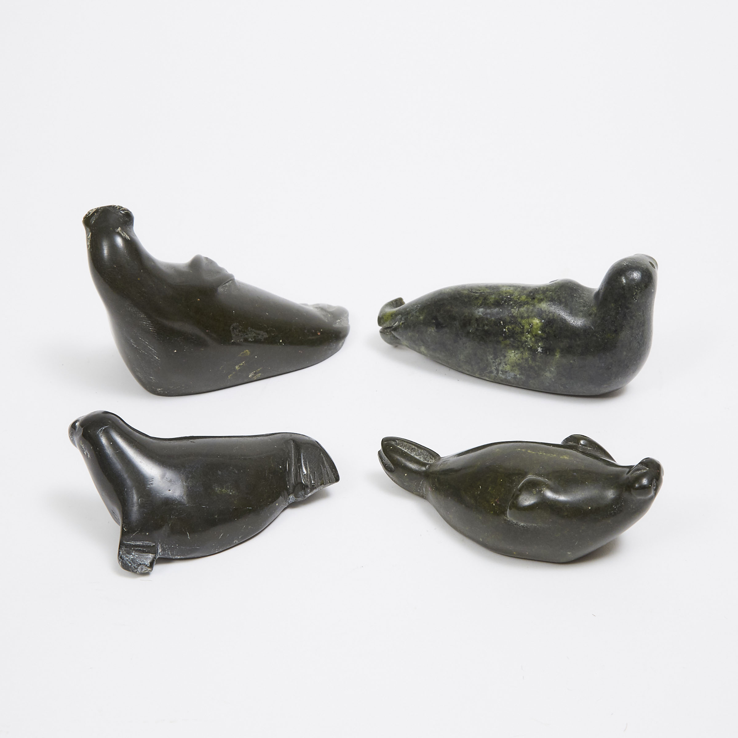 A COLLECTION OF FOUR SEAL SCULPTURES