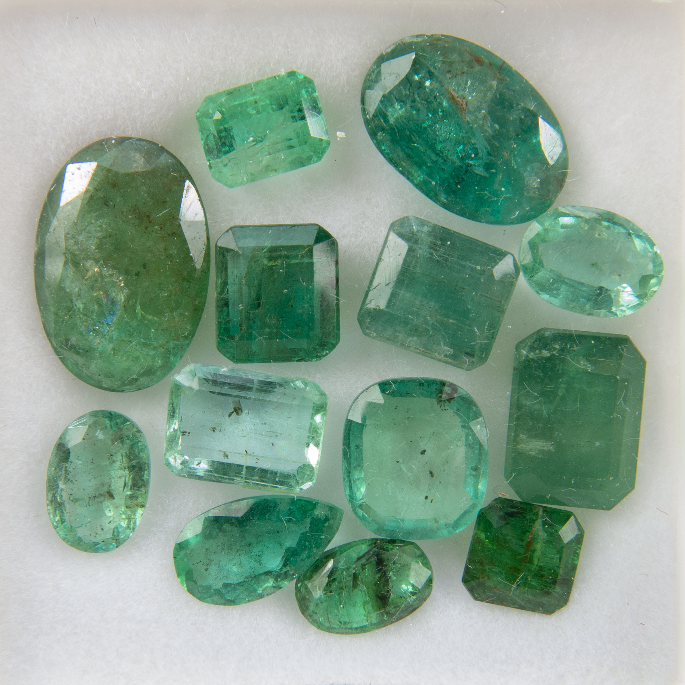 13 Various Cut Emeralds