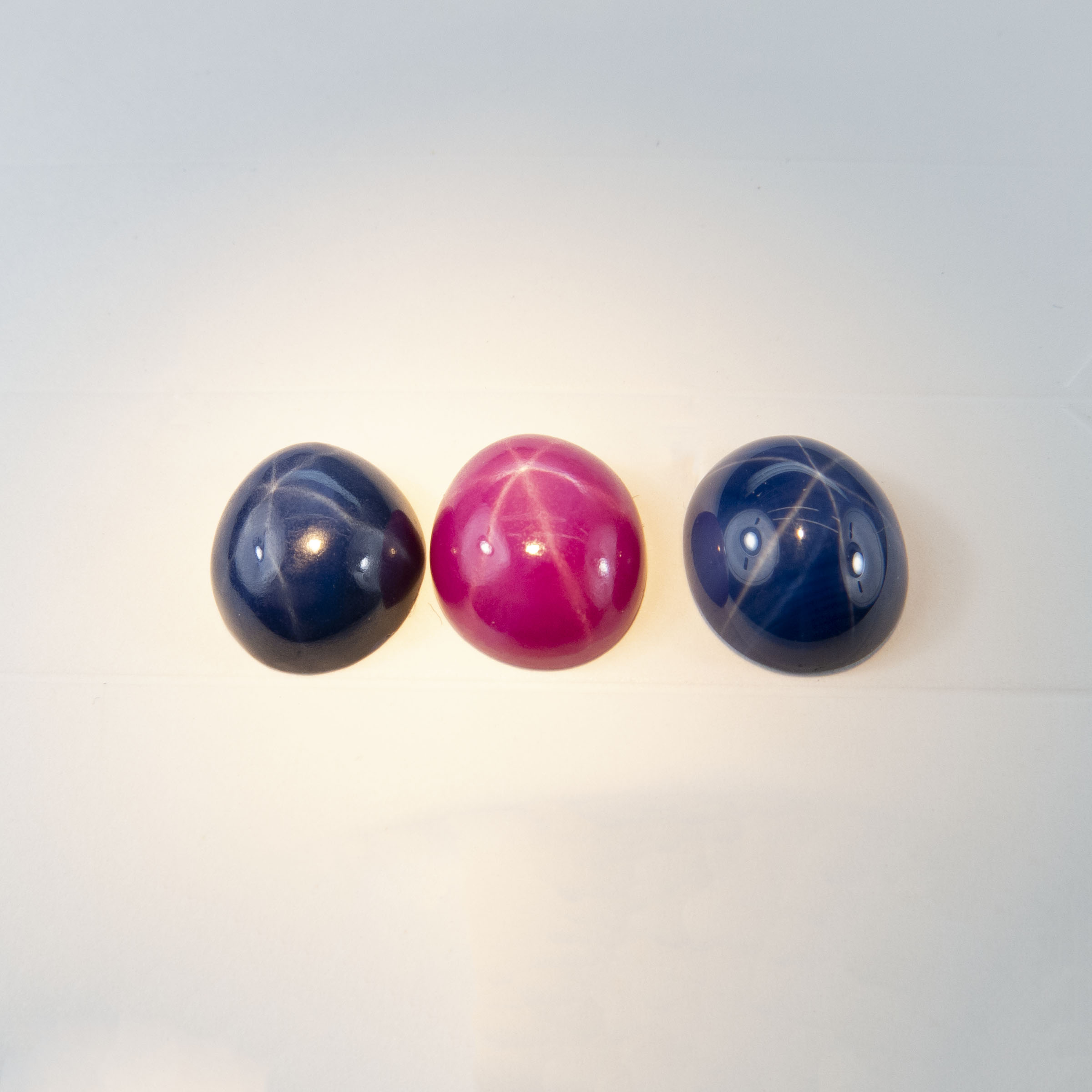 Synthetic Oval Star Ruby And 2 Synthetic Oval Star Sapphire Cabochons