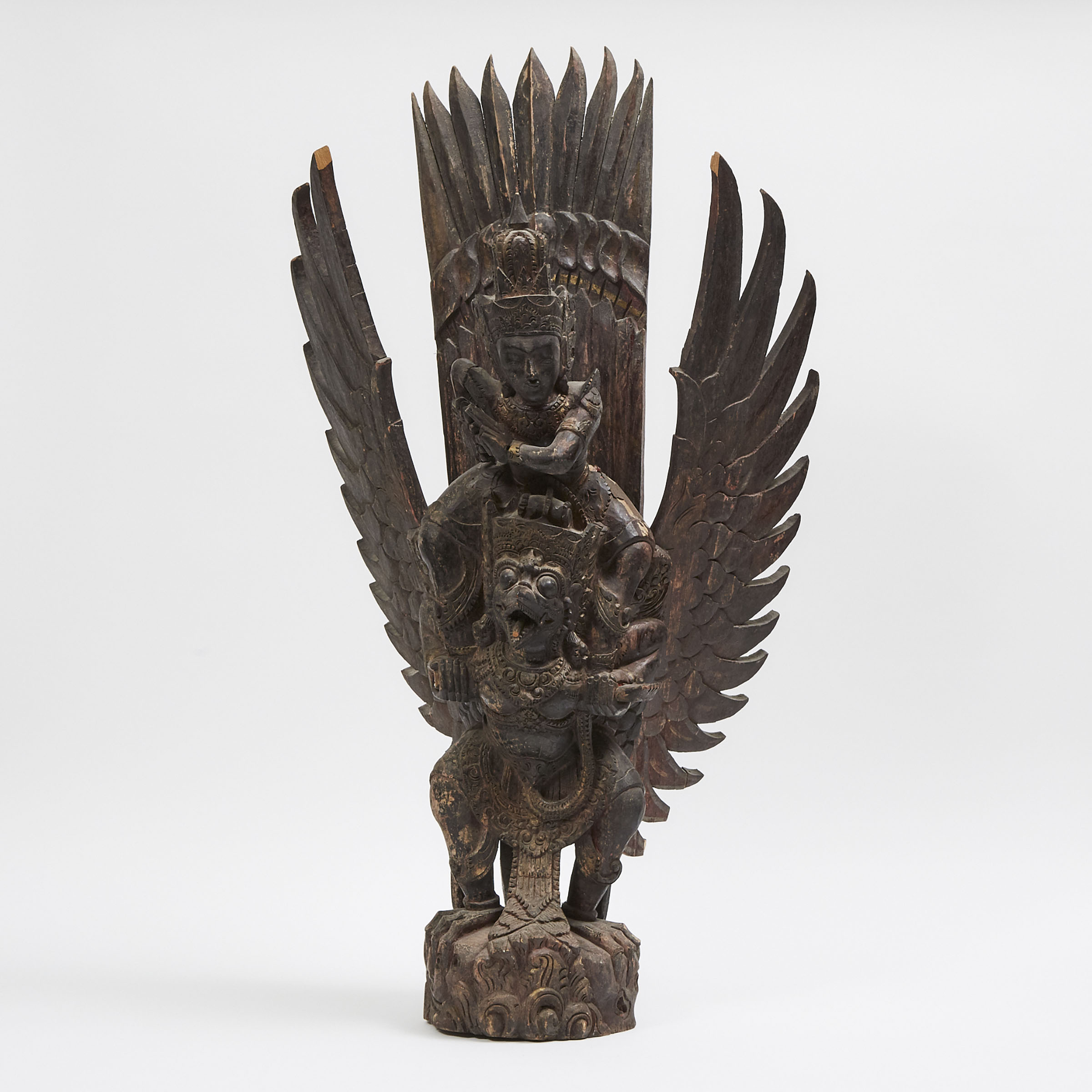 A Balinese Wood Carved Sculpture of Vishnu Riding Garuda, 19th/Early 20th Century