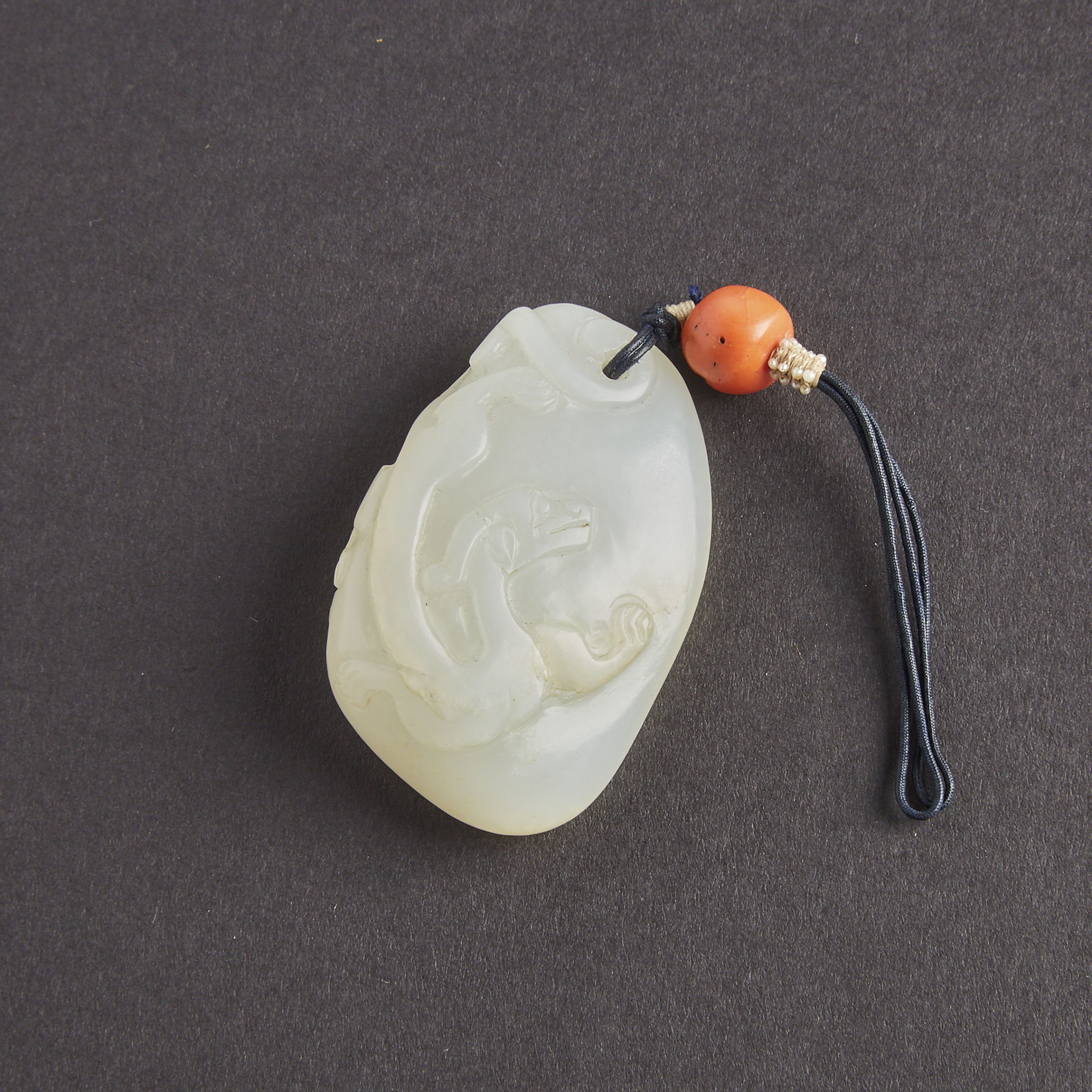 A White Jade Carved 'Chilong' Pebble, Qing Dynasty