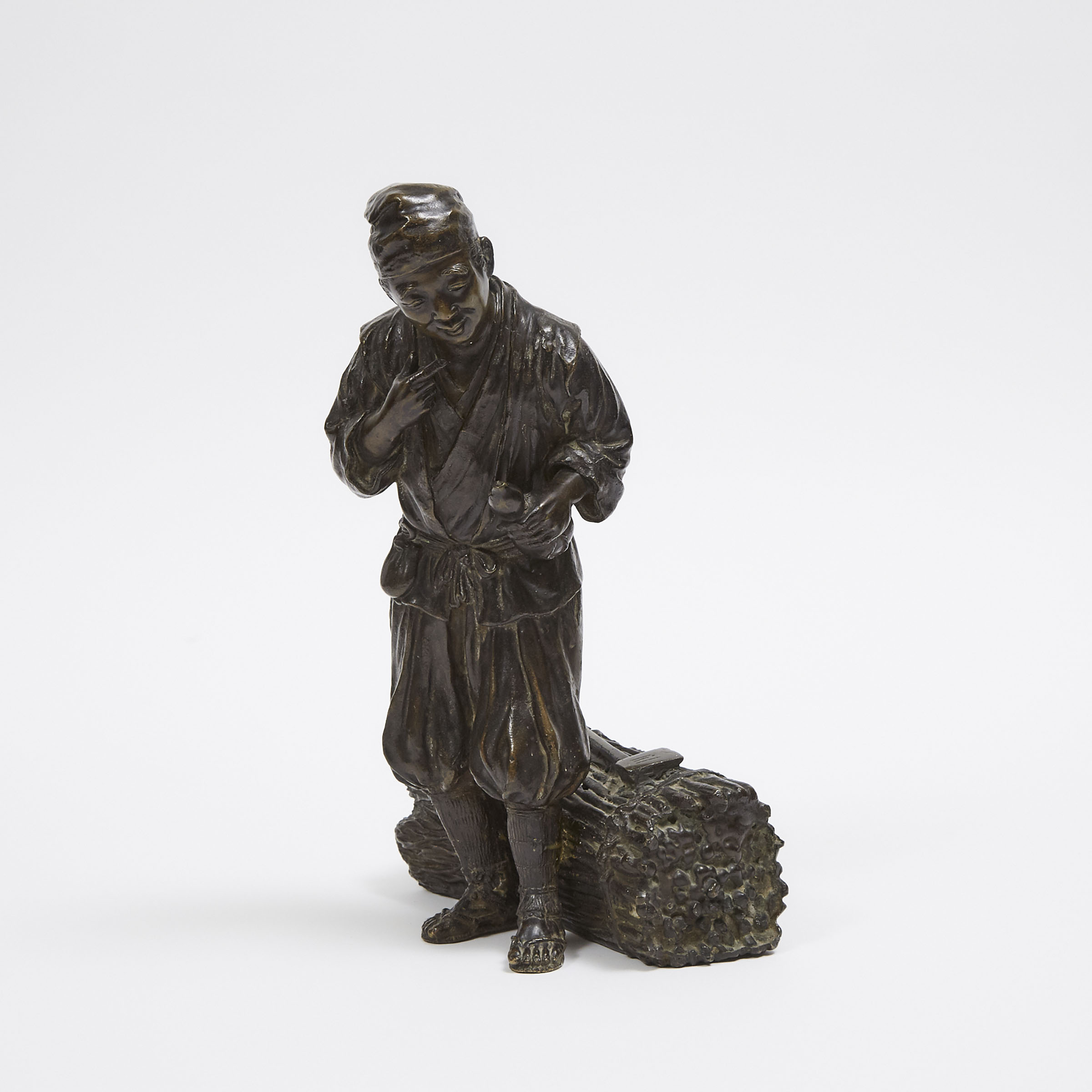 A Japanese Bronze Okimono of a Woodcutter, Early 20th Century