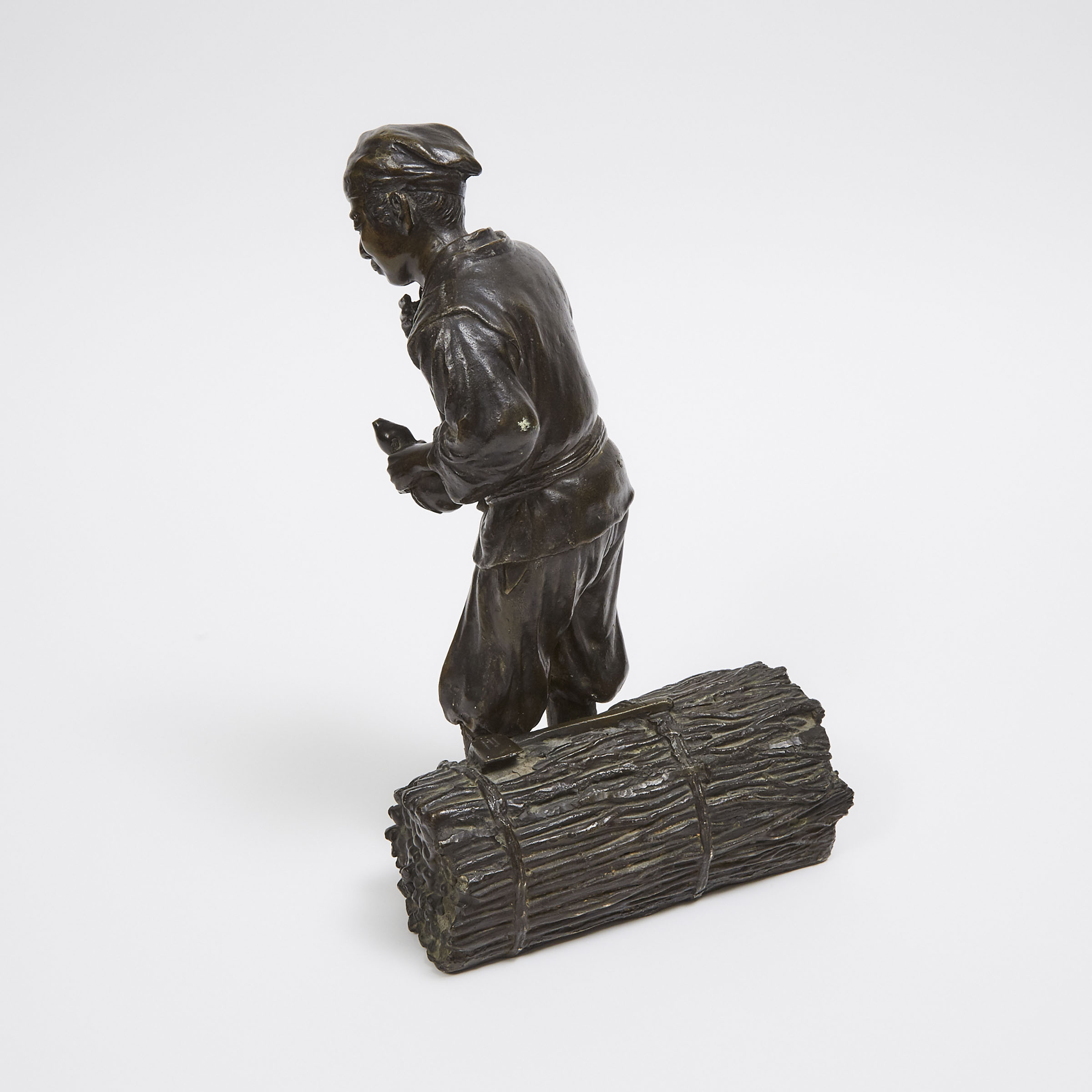 A Japanese Bronze Okimono of a Woodcutter, Early 20th Century