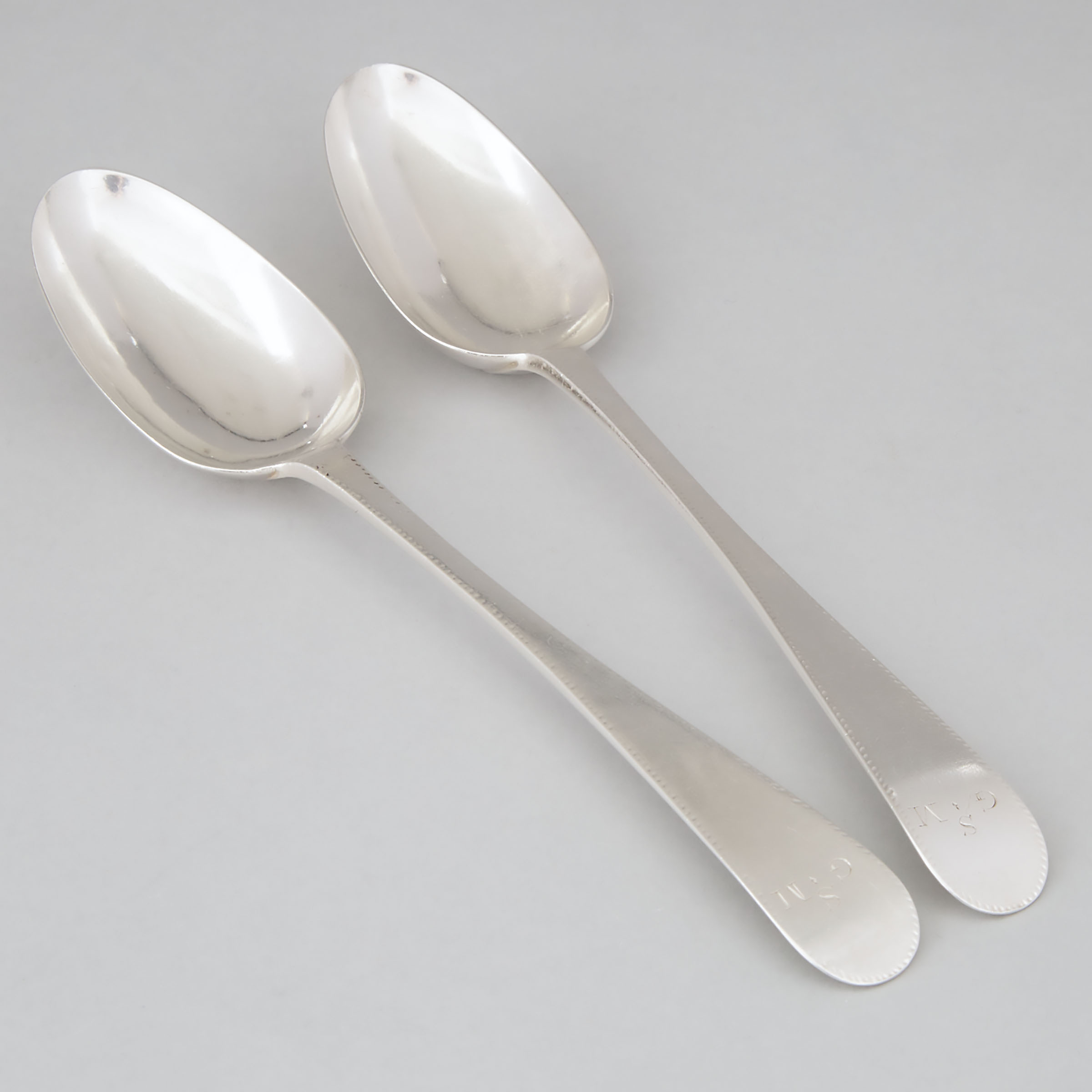 Pair of American Silver Engraved Old English Pattern Table Spoons, Thomas Underhill, New York, N.Y., c.1785-90