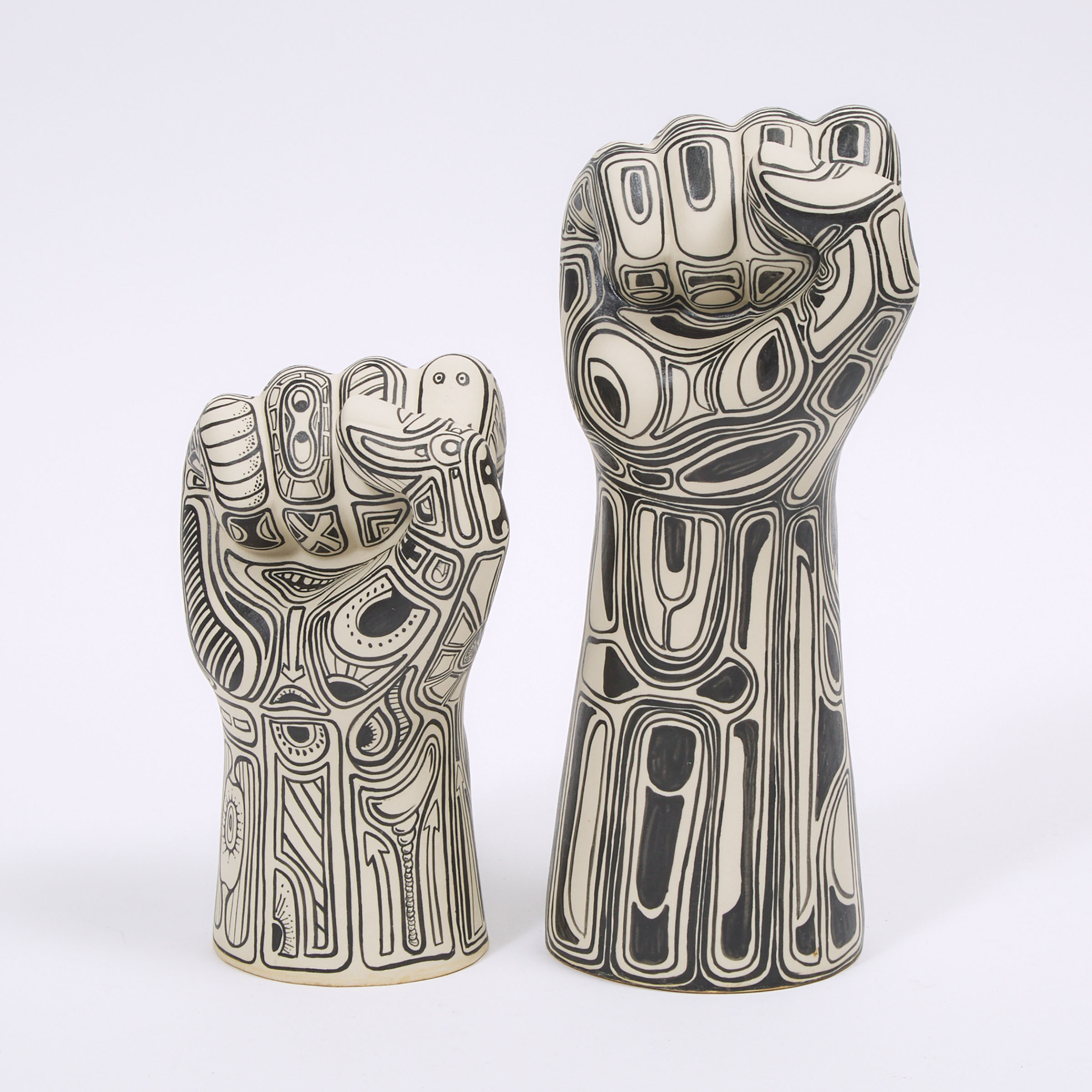 Two First Nations School 'Tattooed' Ceramic Fists, 20th/early 21st century