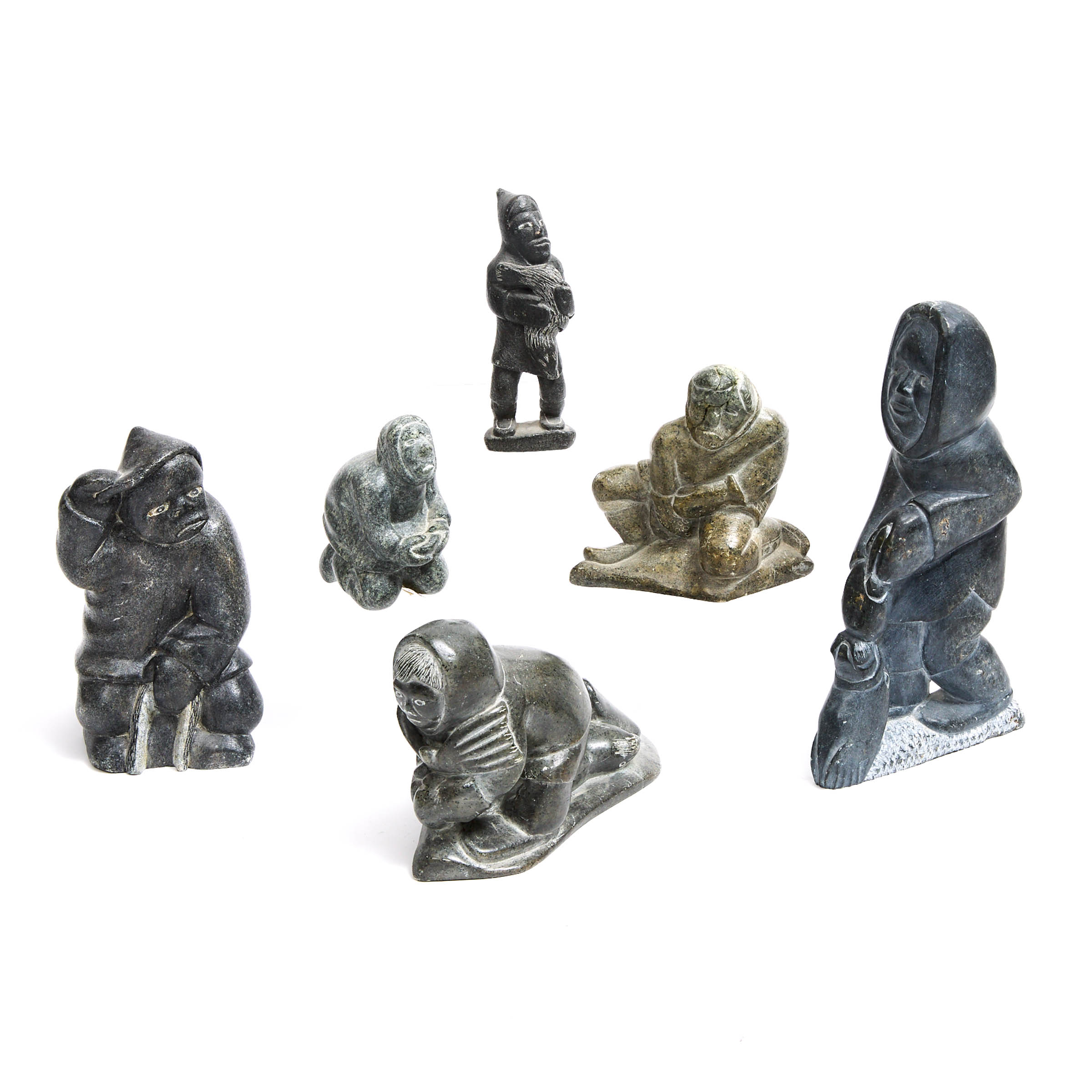 A COLLECTION OF SIX INUIT CARVINGS OF HUNTERS