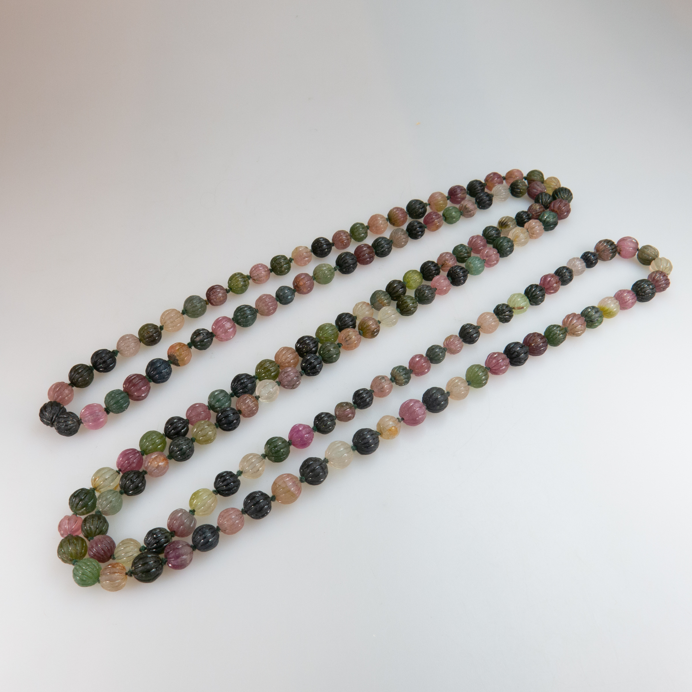 Single Strand Of Various Coloured Carved Tourmaline Beads