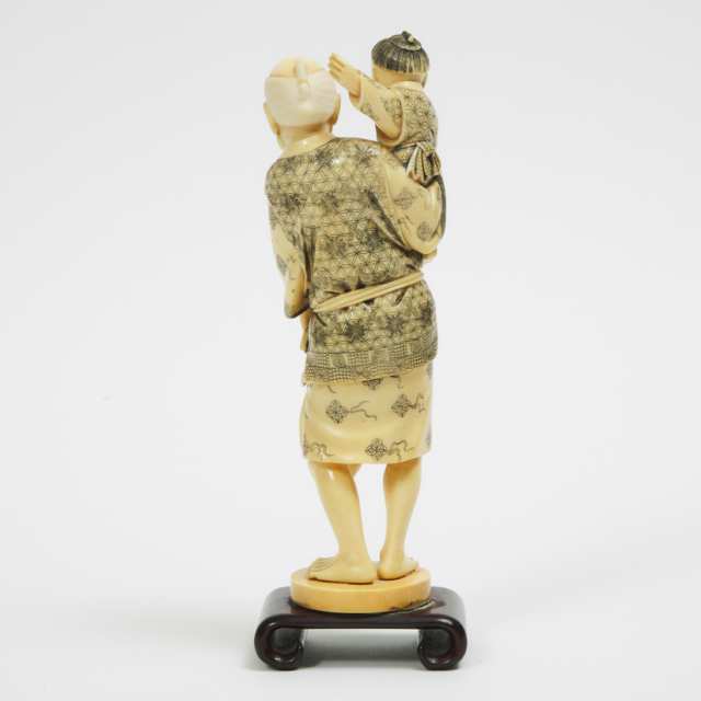 A Ivory Okimono of an Old Man with Child