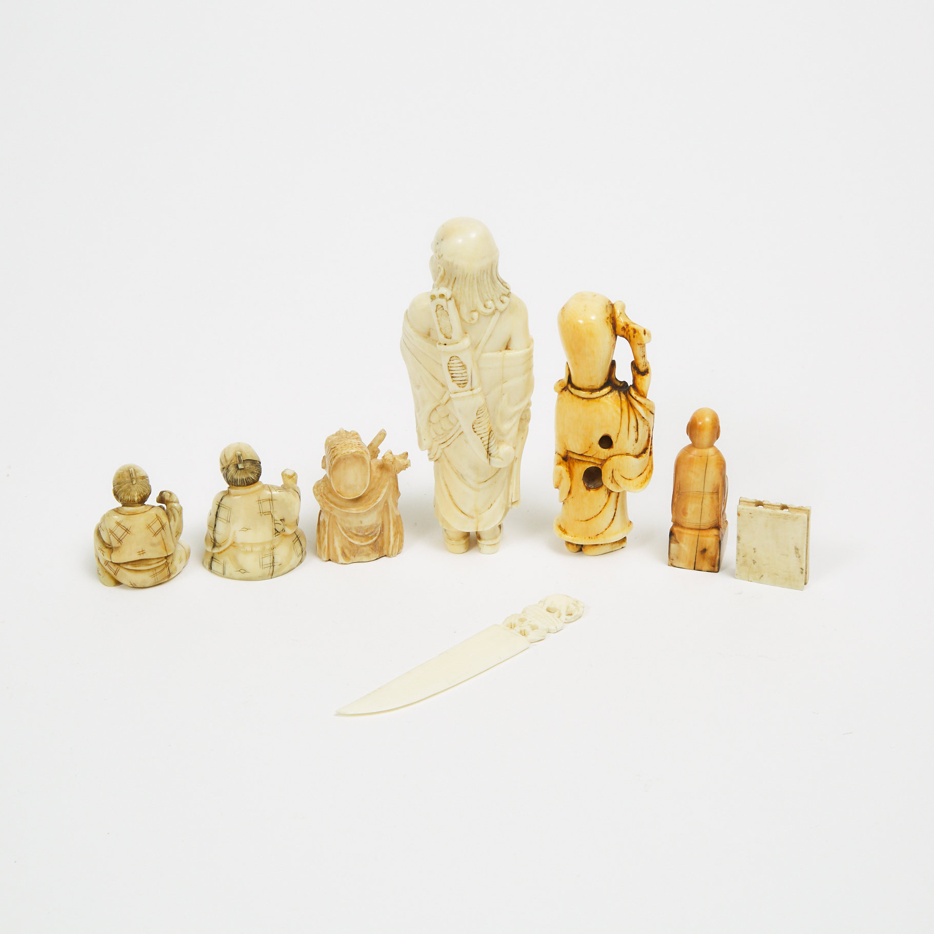A Group of Eight Ivory Netsuke and Miscellaneous Carvings, 18th/19th Century