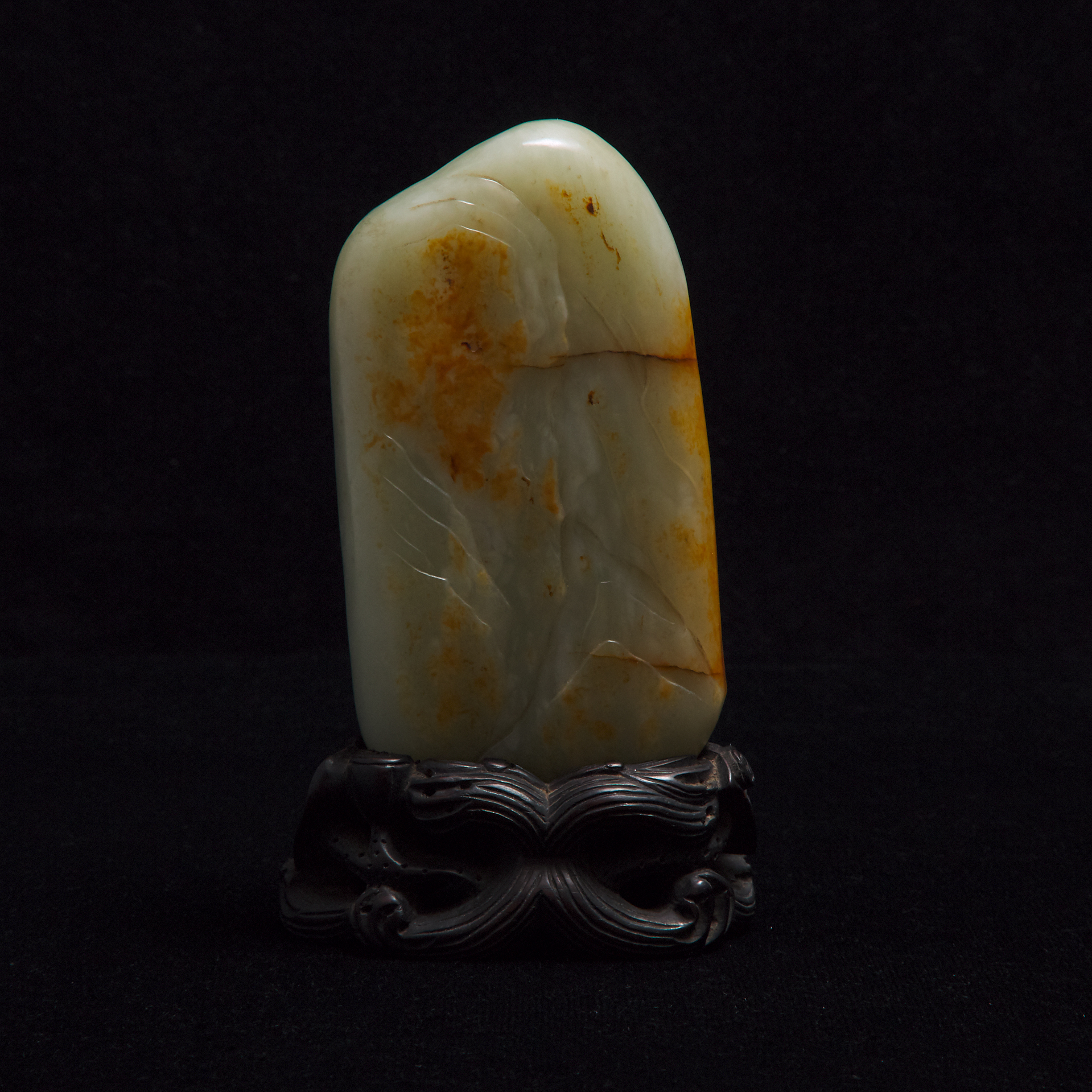 A Pale Celadon and Russet Jade 'Scholar and Boy' Boulder