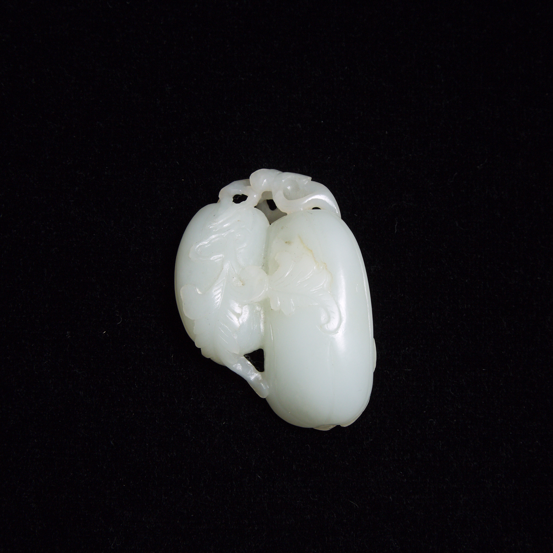 A White Jade 'Melon and Butterfly' Carving, Qing Dynasty