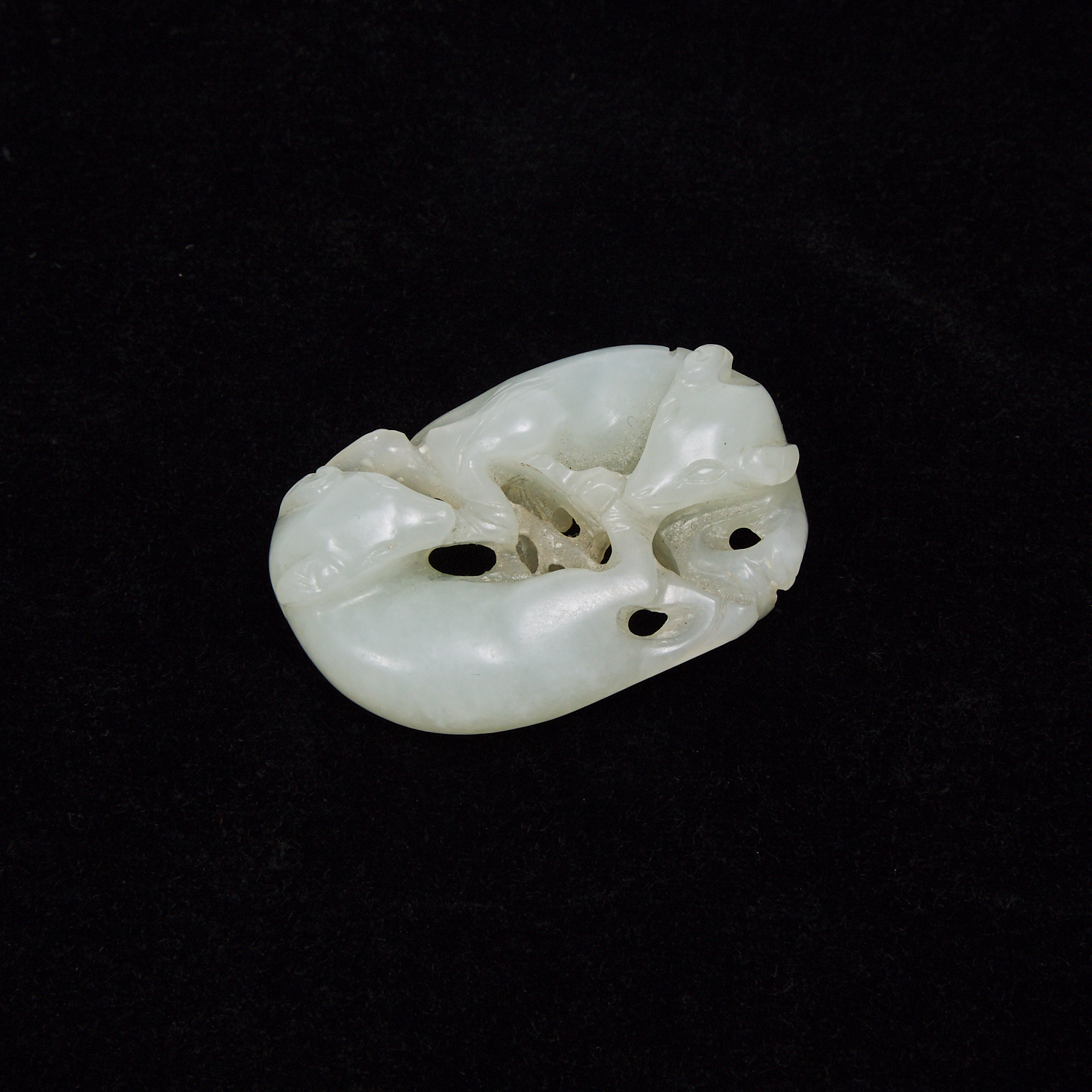 A White Jade Carving of Two Badgers, Qing Dynasty