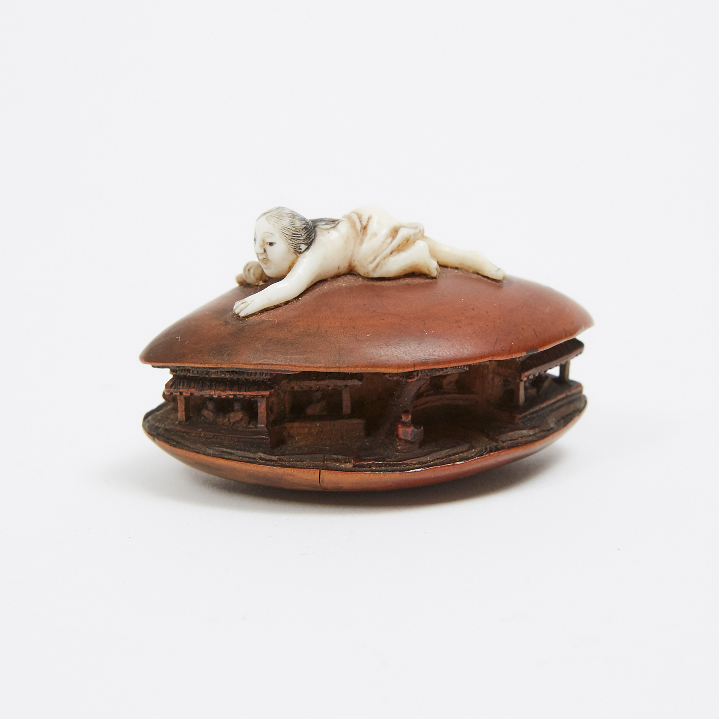 A Boxwood and Ivory Carved Netsuke of a Pearl Diver, Late 19th Century