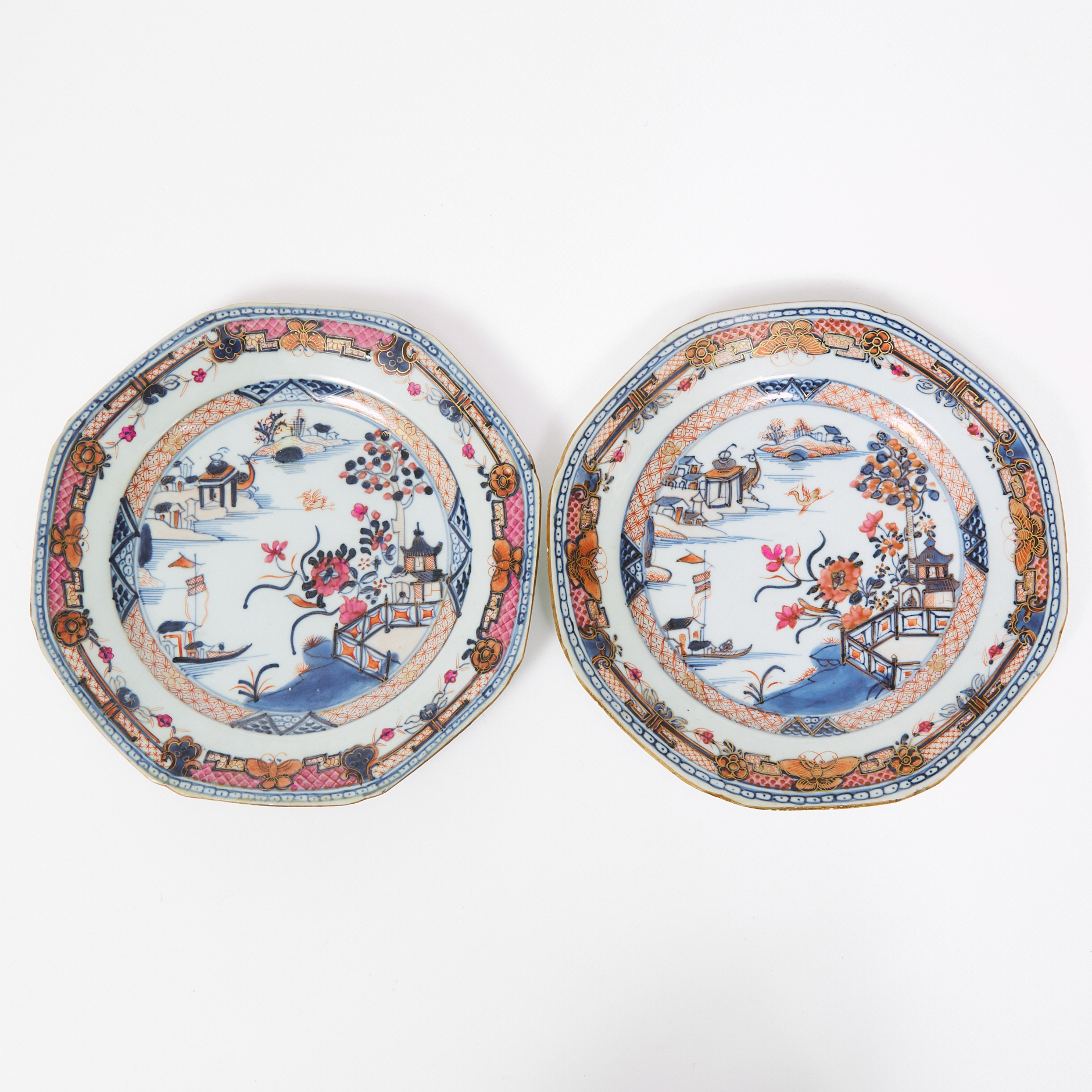 An Extremely Rare Pair of Octagonal Blue and White Pink-Enameled and Gilt 'Landscape' Plates, Yongzheng/Qianlong Period, 18th Century
