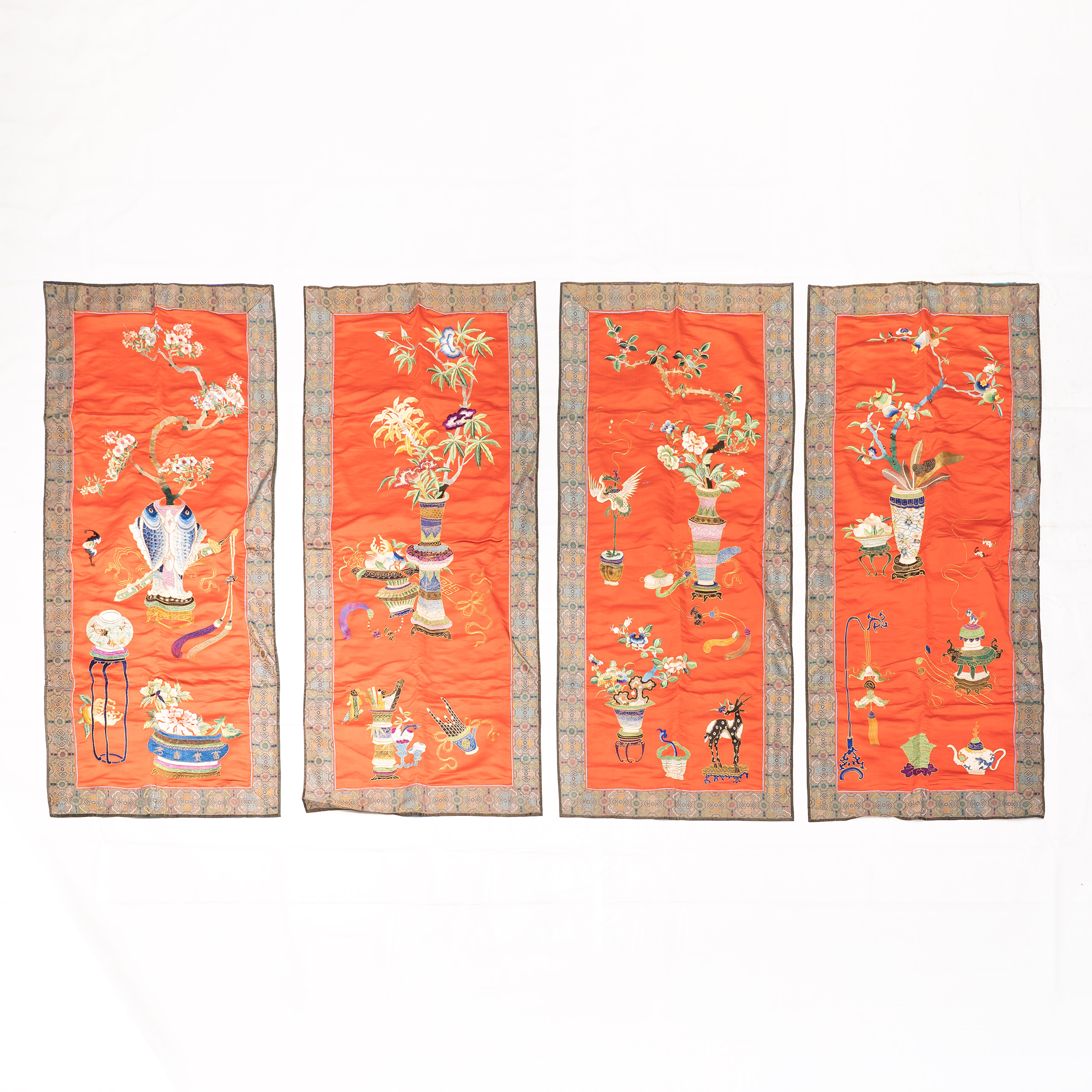 A Set of Four Chinese Embroidered 'Hundred Antiques' Red Silk Panels, Late Qing Dynasty