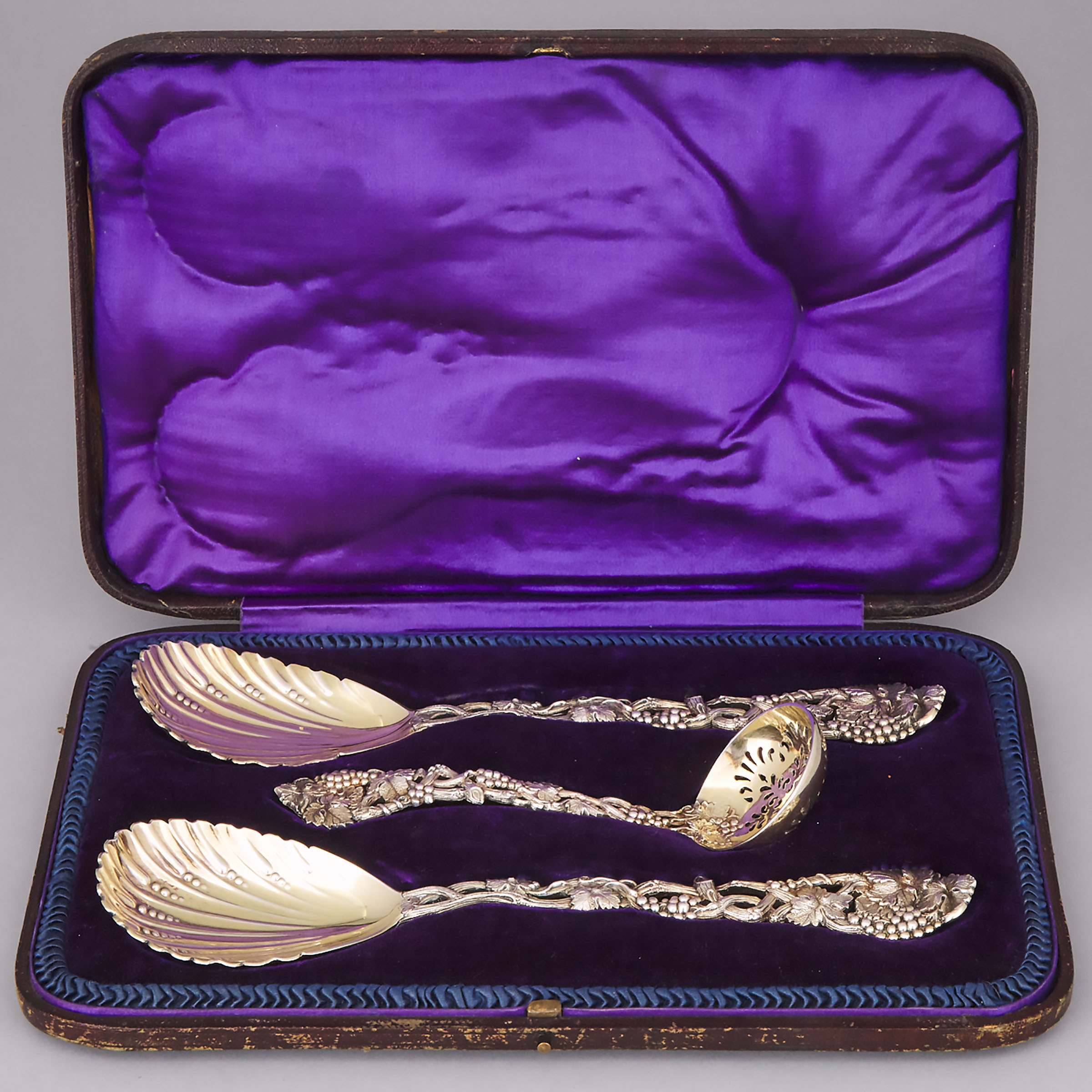 Pair of Victorian Silver-Gilt Vine Pattern Berry Spoons and a Sifting Ladle, John Aldwinckle & Thomas Slater, London, 1890/91