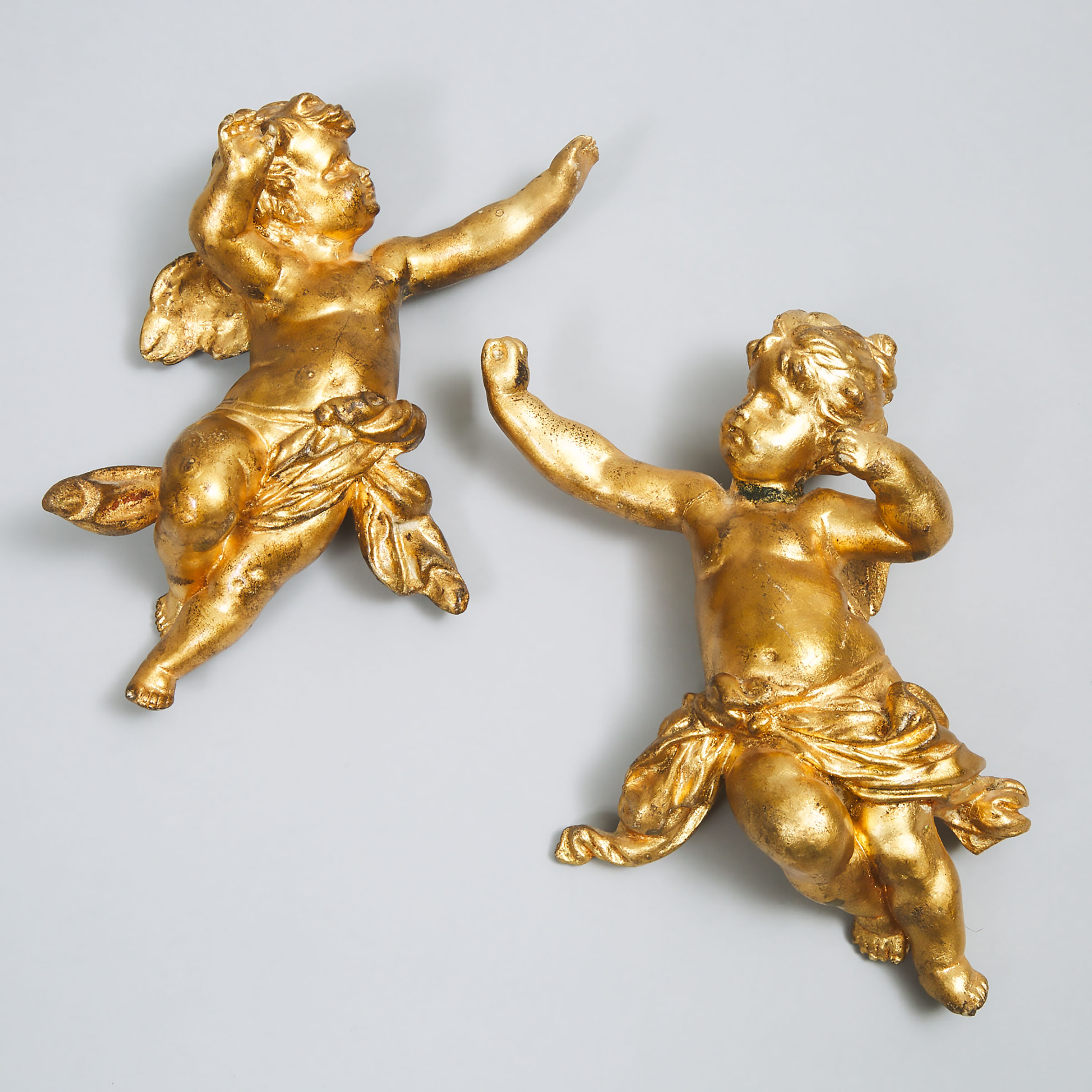 Pair of Continental Gilt Composite Figures of Cherubic Angels, 19th/20th century