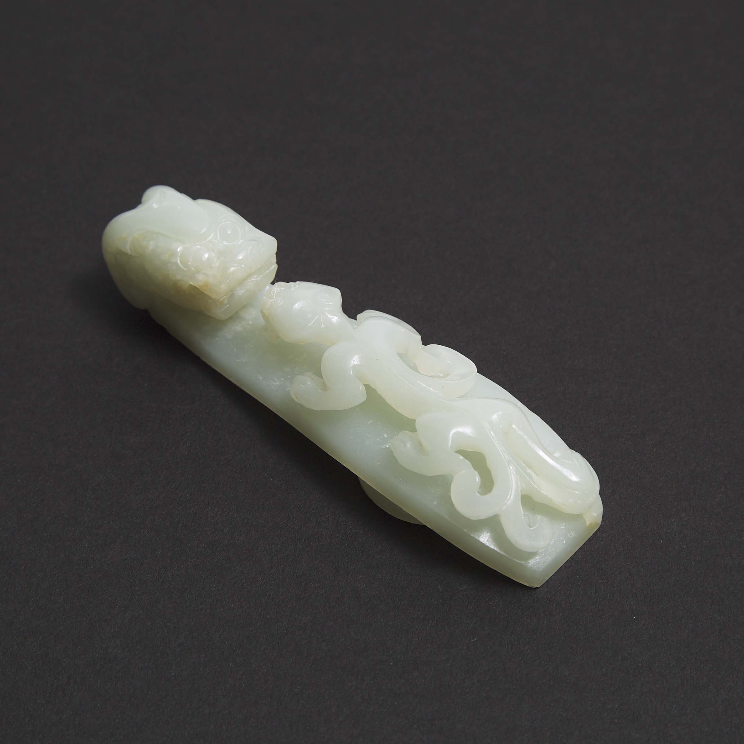 A Mottled White Jade Belt Hook, Qing Dynasty