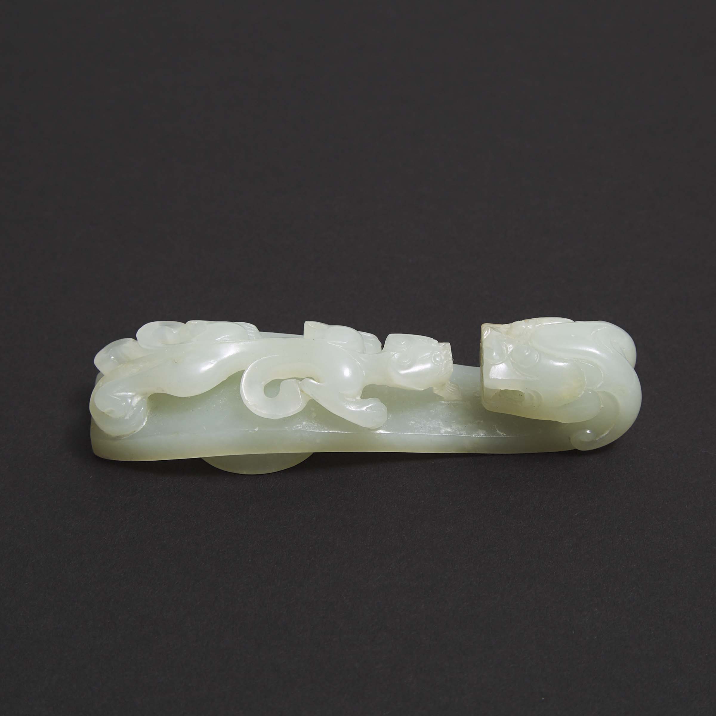 A Mottled White Jade Belt Hook, Qing Dynasty