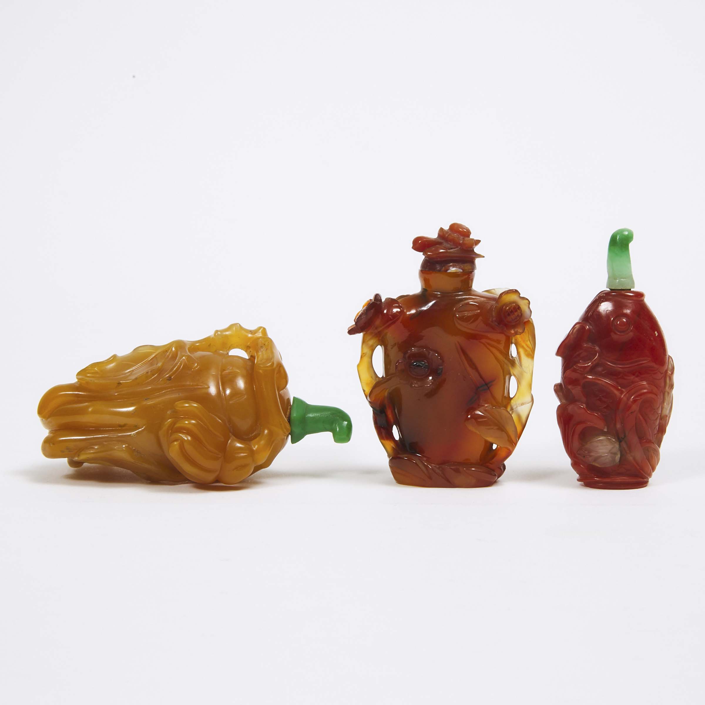 A Group of Three Agate and Carnelian Carved Snuff Bottles, 19th/20th Century