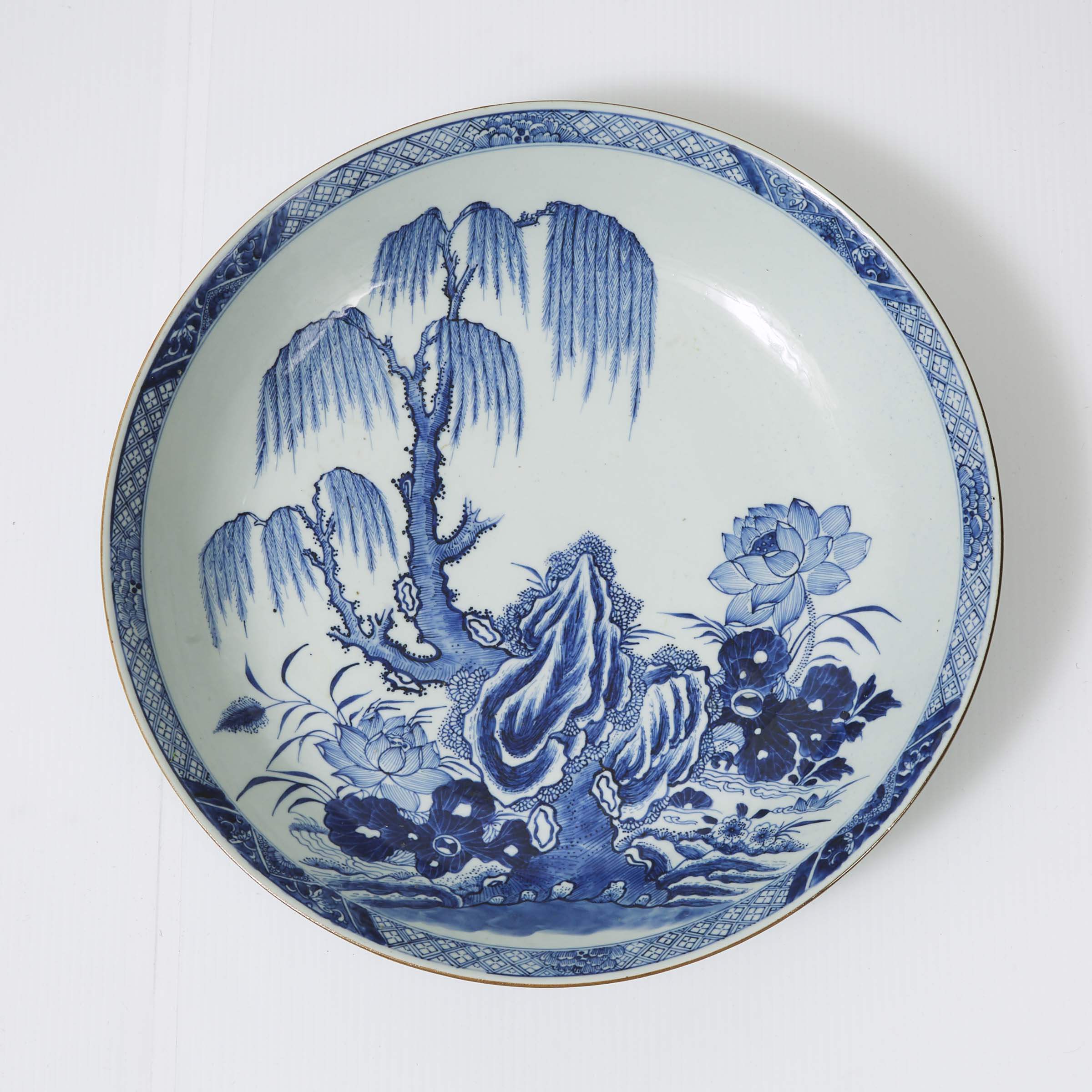A Large Blue and White 'Willow and Lotus' Charger, 18th Century
