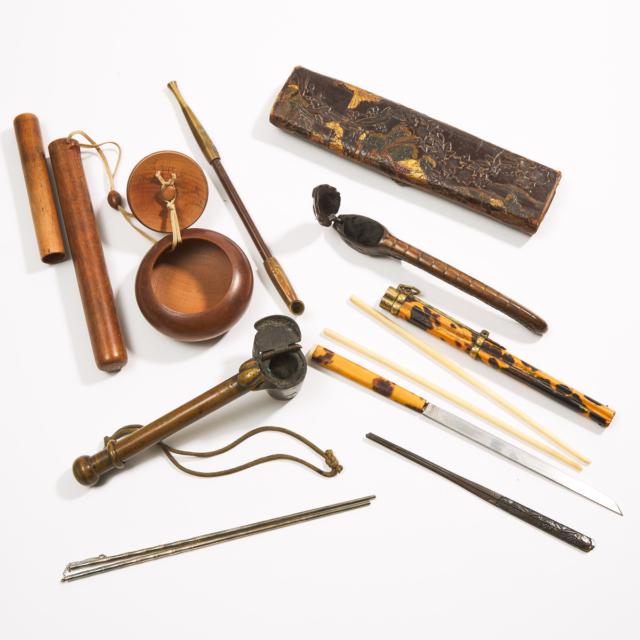 A Group of Three Japanese Pipes, Three Pairs of Chopsticks, Six Ukiyo-e Books, Four Banknotes, an Embossed Leather Pouch, and an Eighth Class Order of the Rising Sun Medal, Late 19th-Mid 20th Century