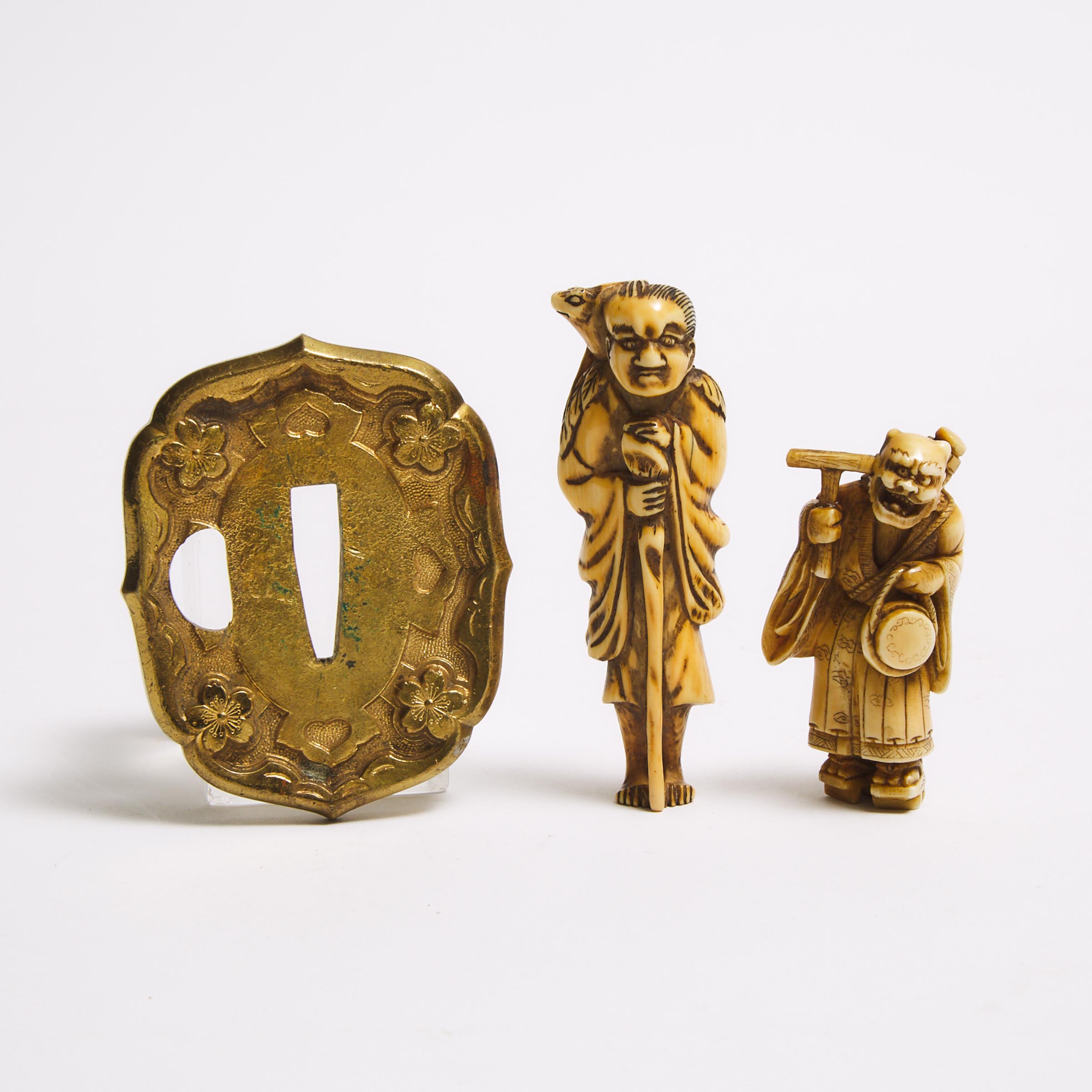 Two Ivory Carved Netsuke, Meiji Period, together with a Gilt Metal Tsuba
