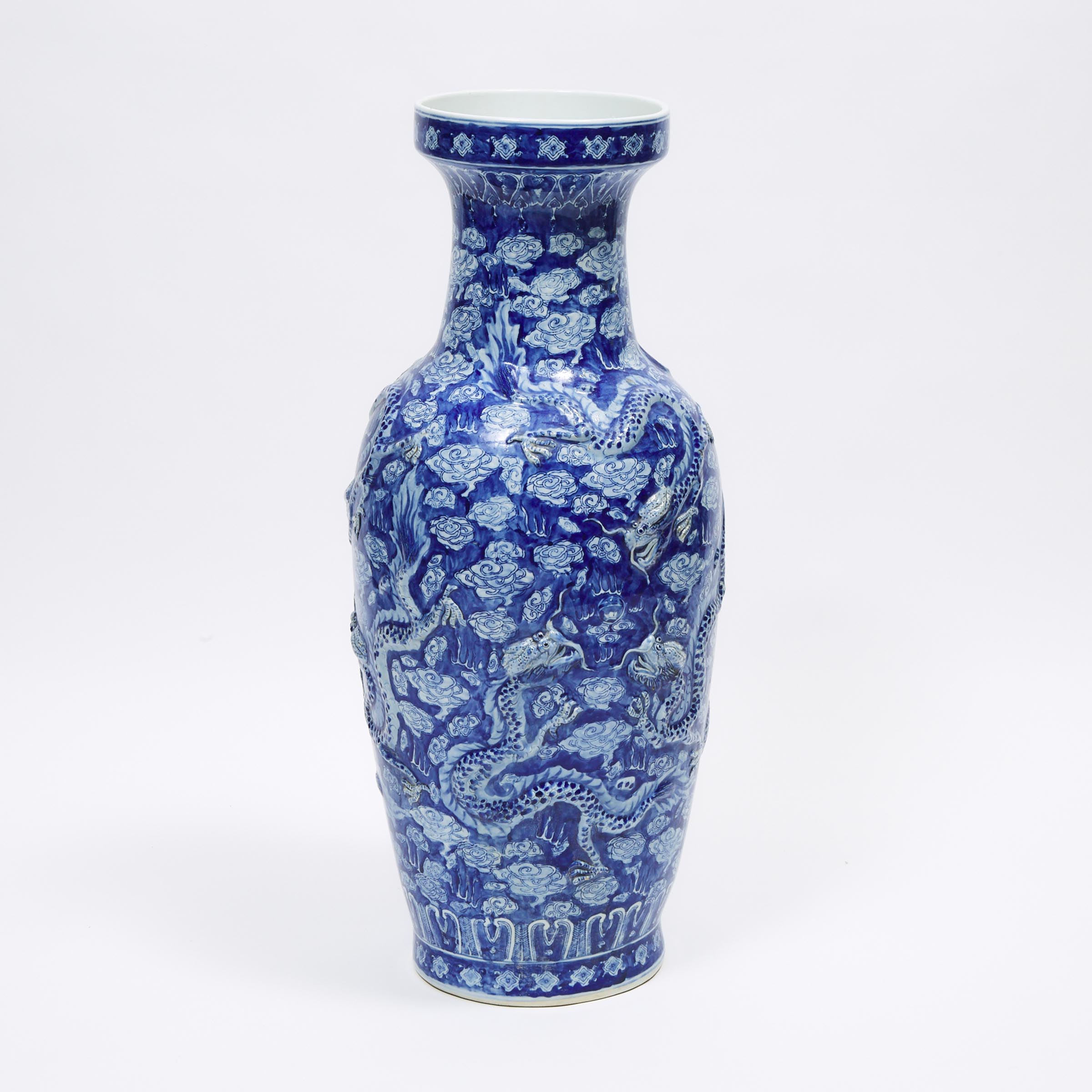 A Large Blue and White Moulded 'Dragon' Floor Vase