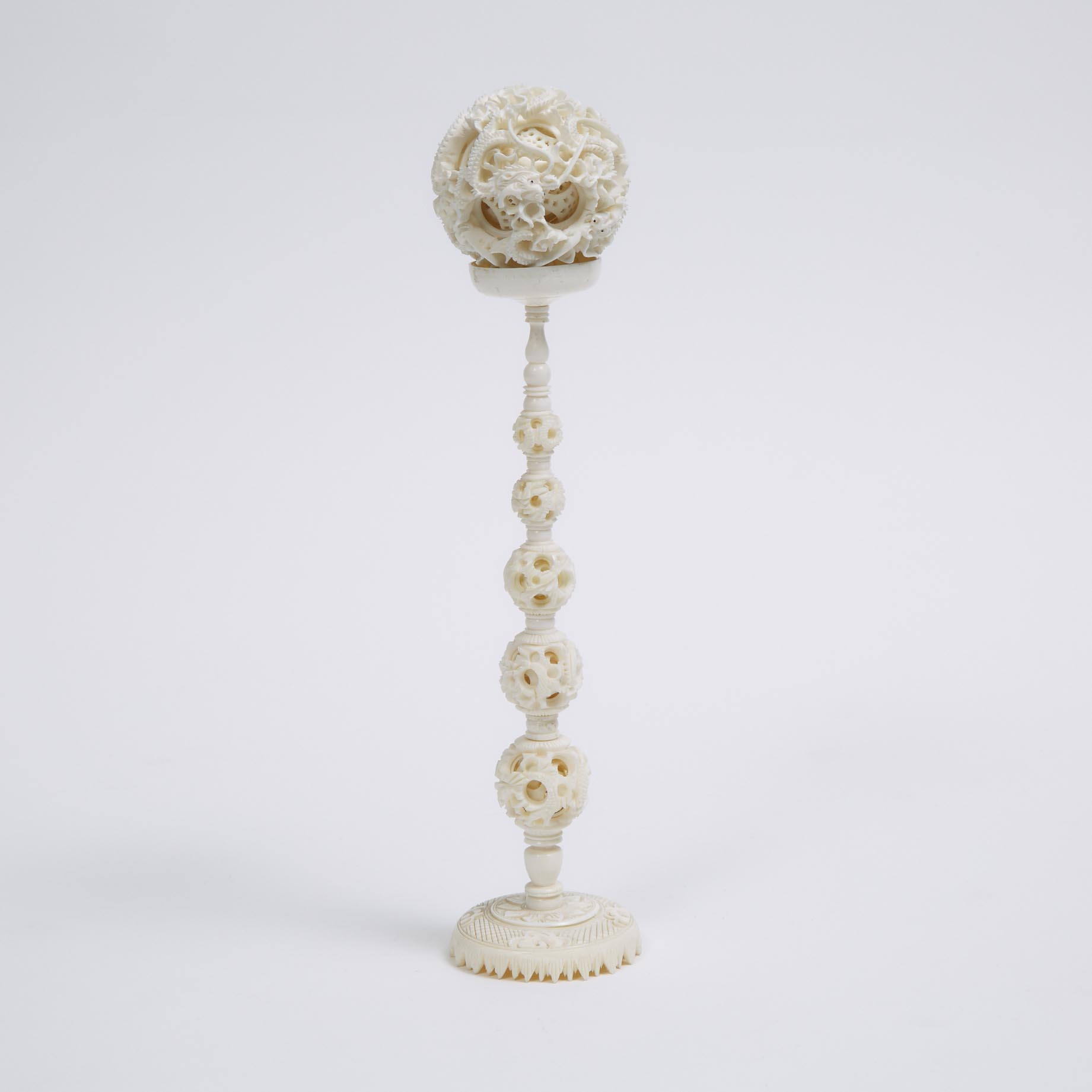A Chinese Ivory Puzzle Ball and Stand