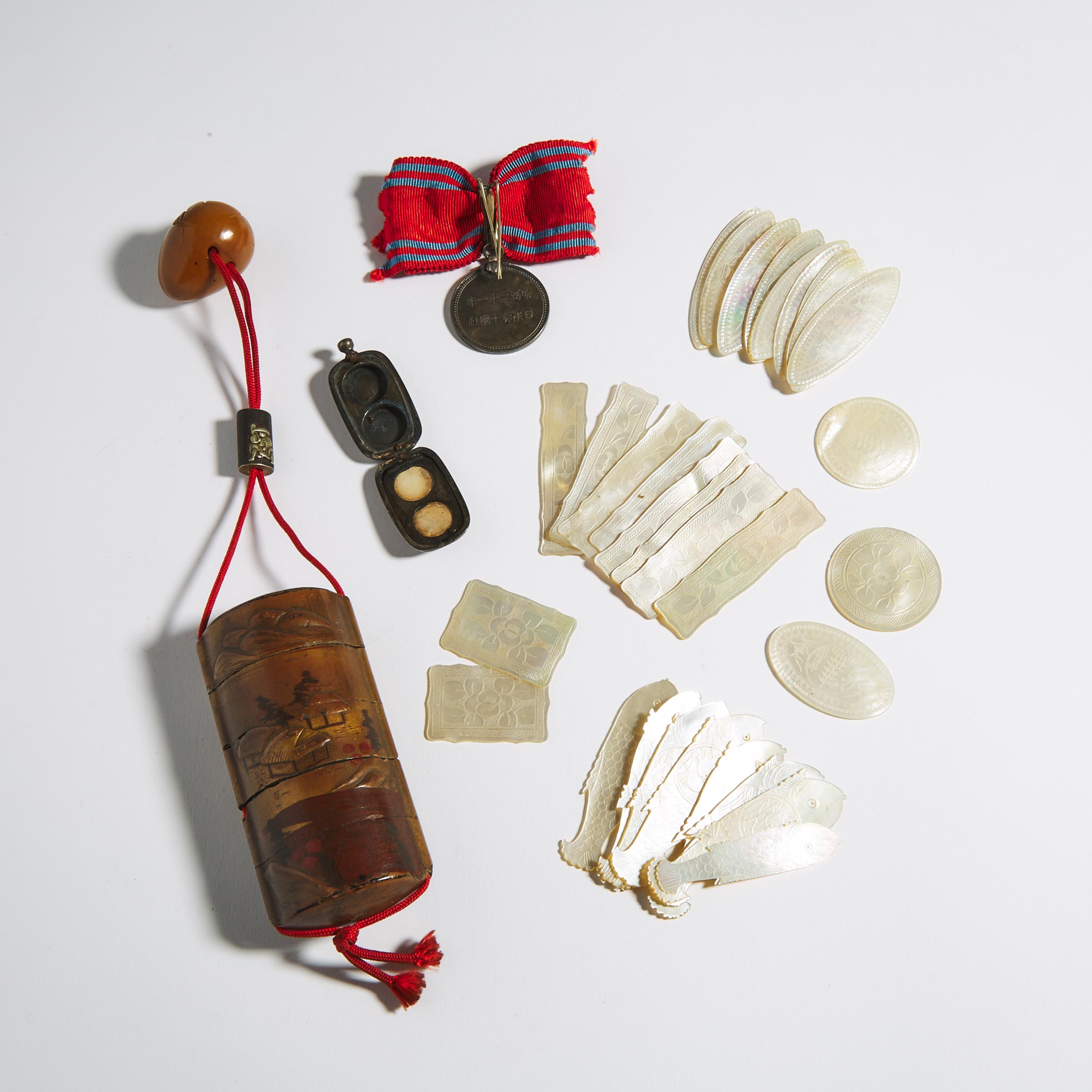 A Group of Thirty Mother-of-Pearl Gaming Counters, together with a Four-Case Inro and a Japanese Red Cross Medal and Locket