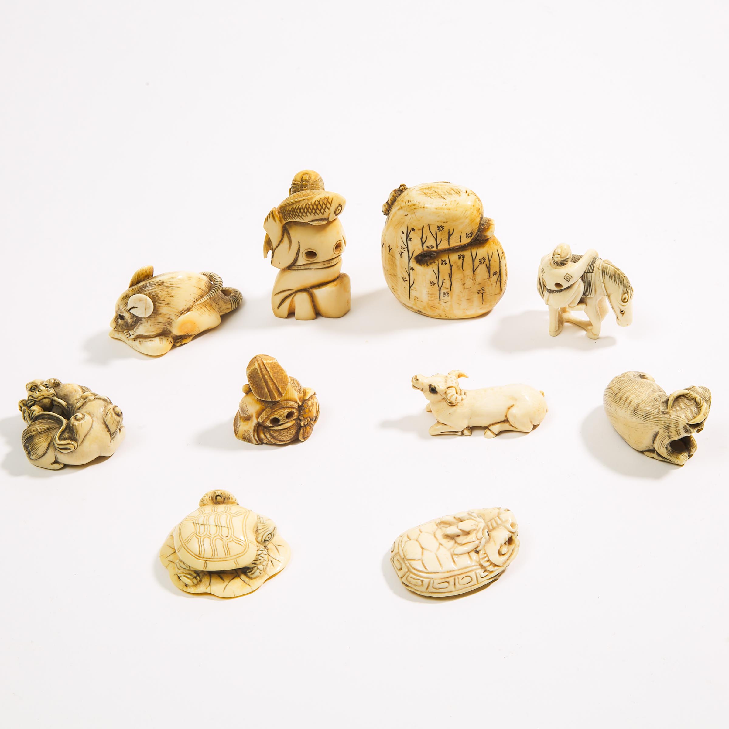A Group of Ten Ivory Carved Netsuke