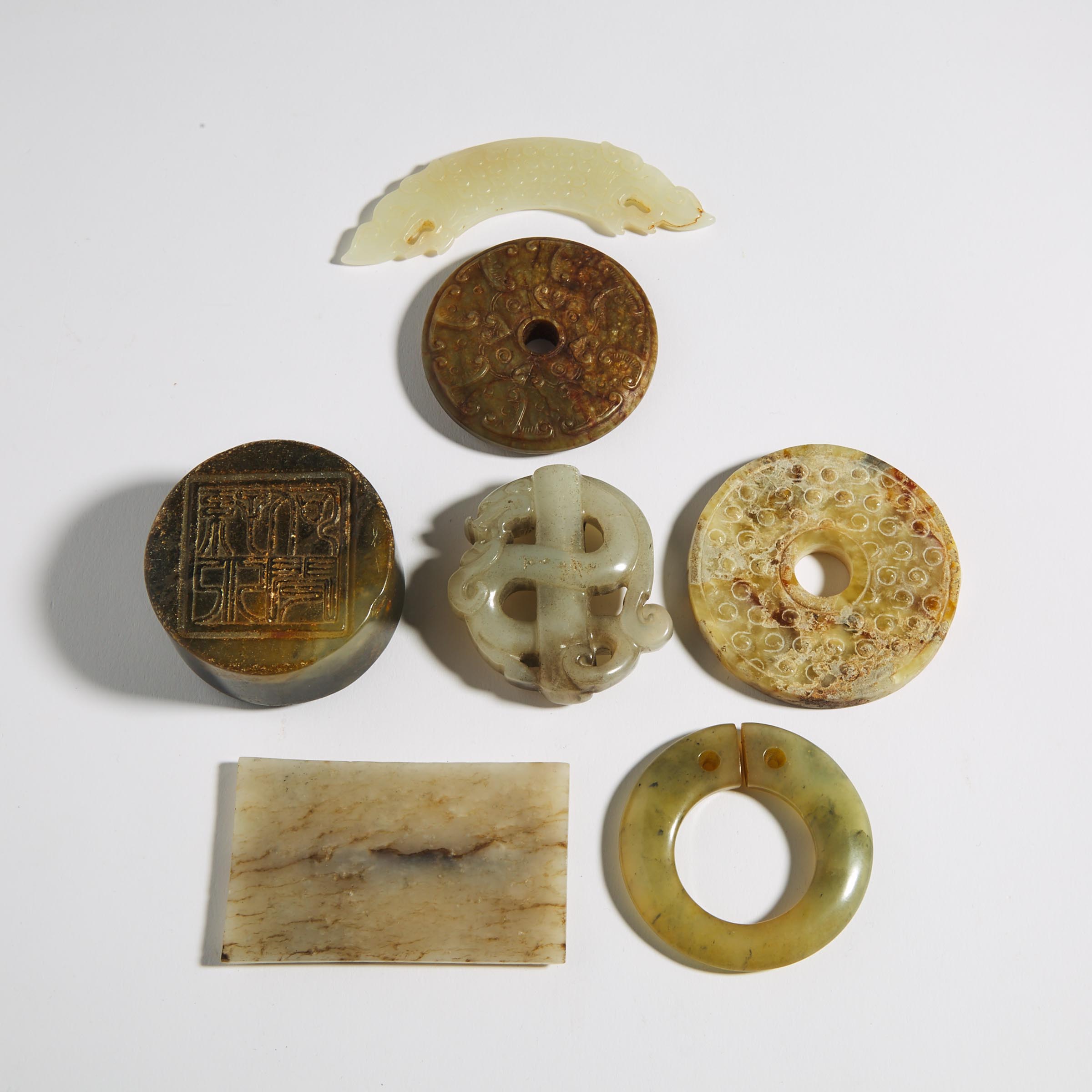 A Group of Seven Archaic-Style Jade and Hardstone Carvings