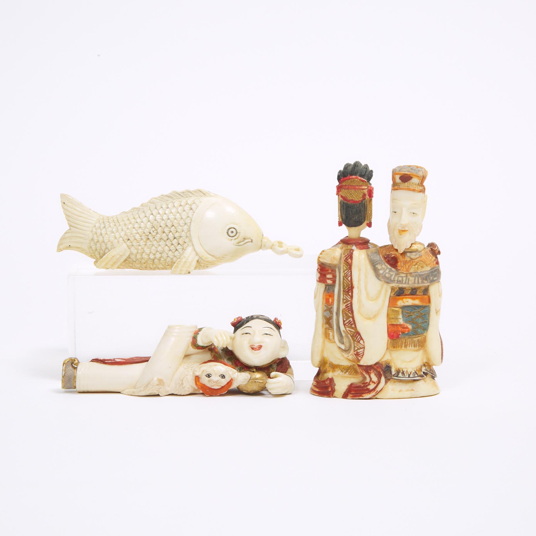 A Group of Three Ivory Snuff Bottles, Early 20th Century