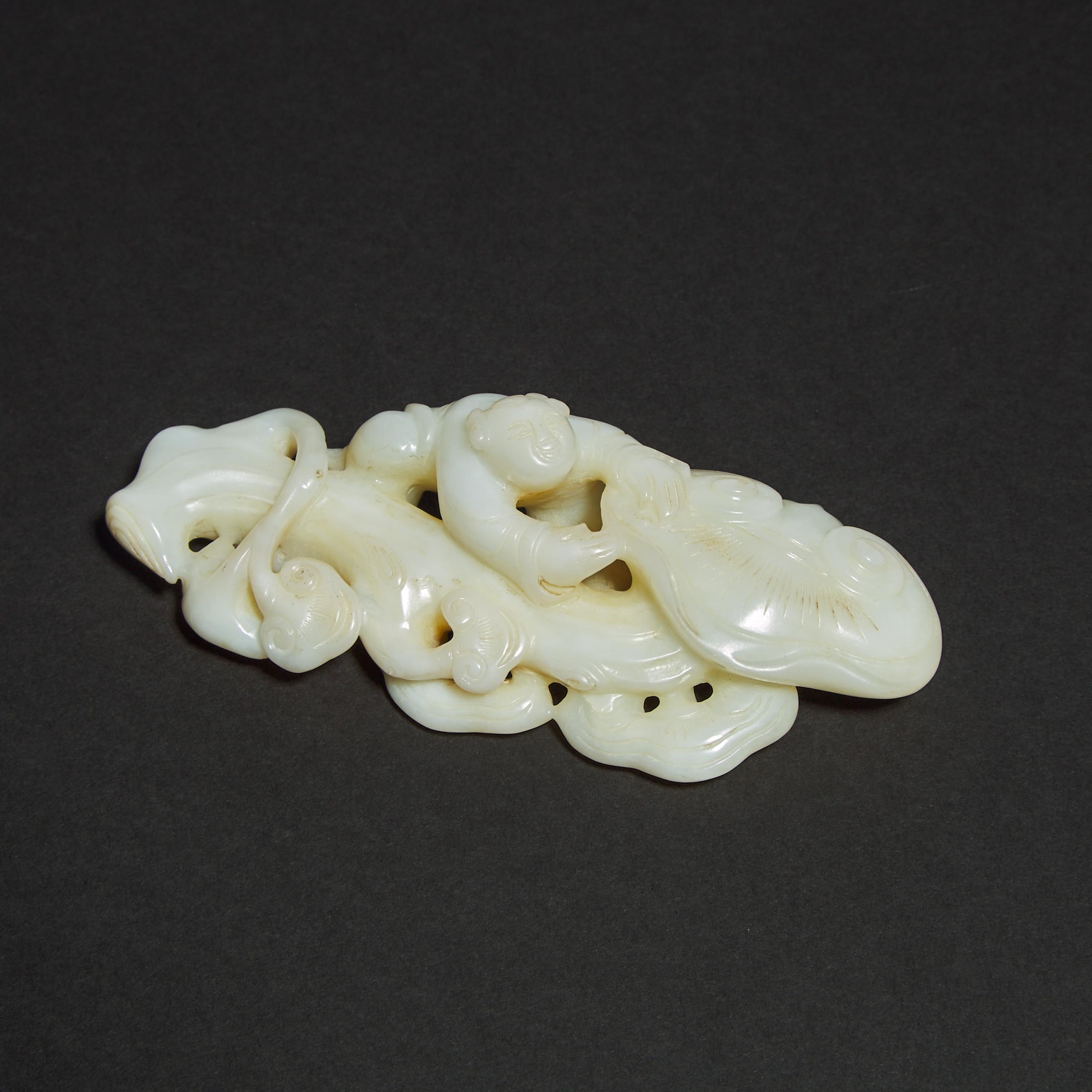 A White Jade Carved 'Boy and Lingzhi' Group