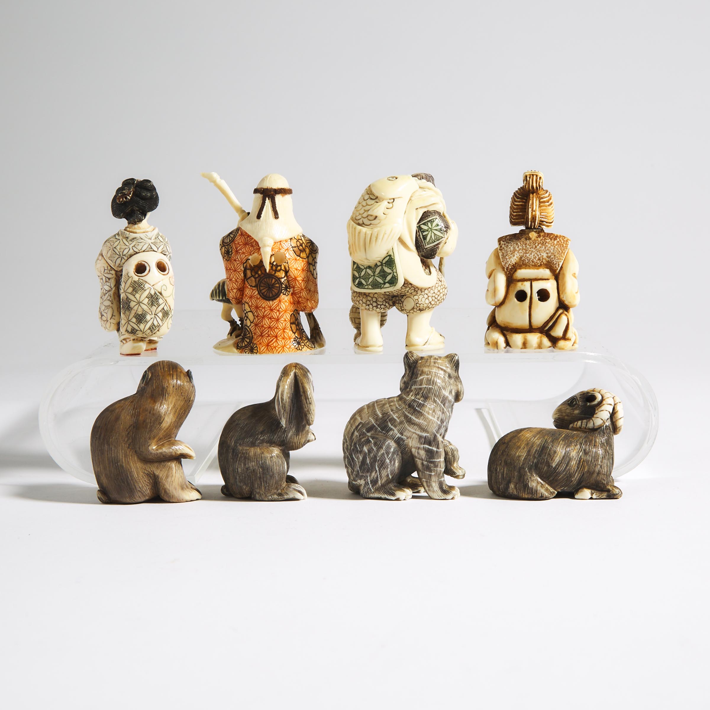 A Group of Eight Ivory Carved Netsuke