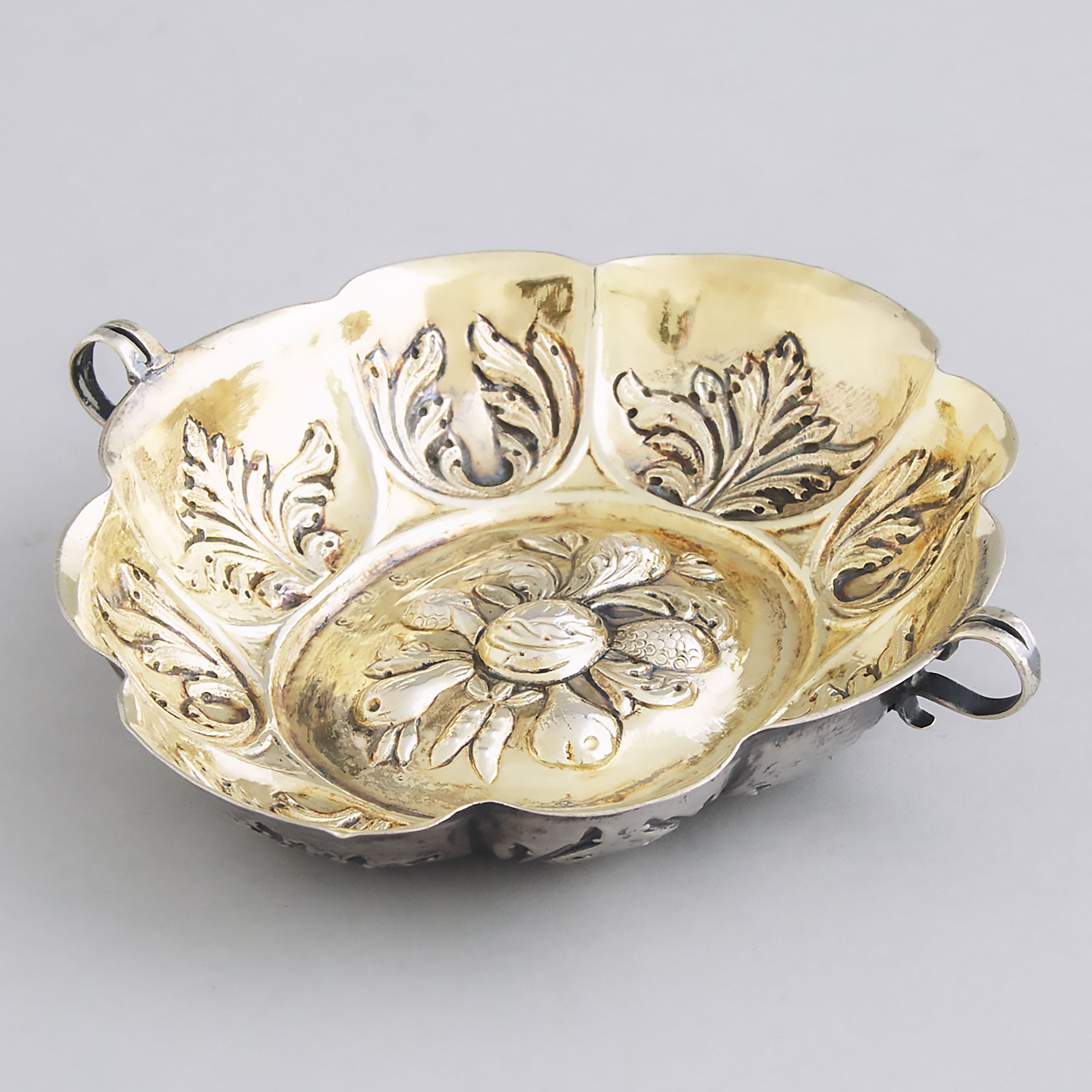 German Silver Parcel-Gilt Two-Handled Lobed Oval Brandy Bowl, early 19th century