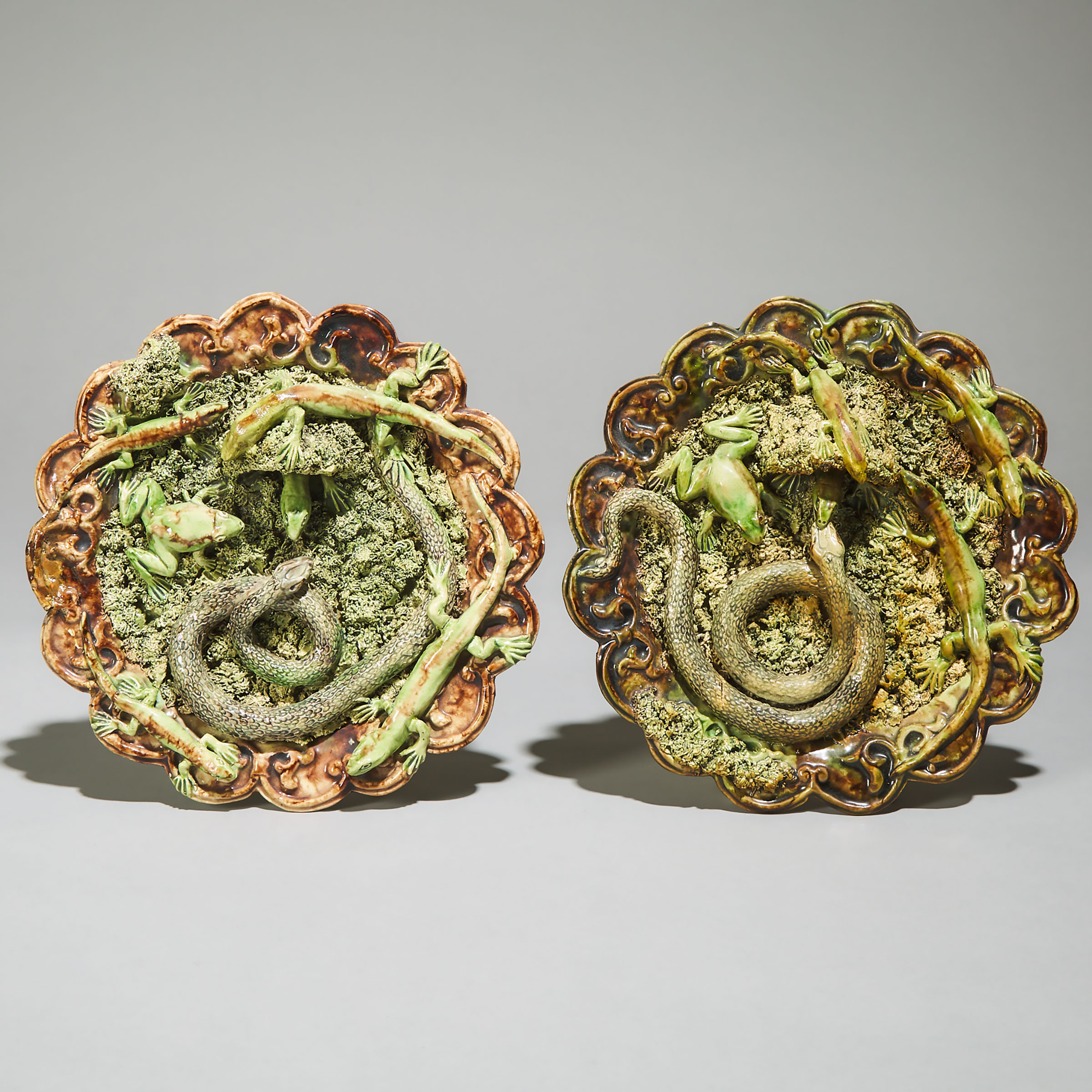 Pair of José Cunha Majolica Palissy-Style Circular Wall Plaques, late 19th century