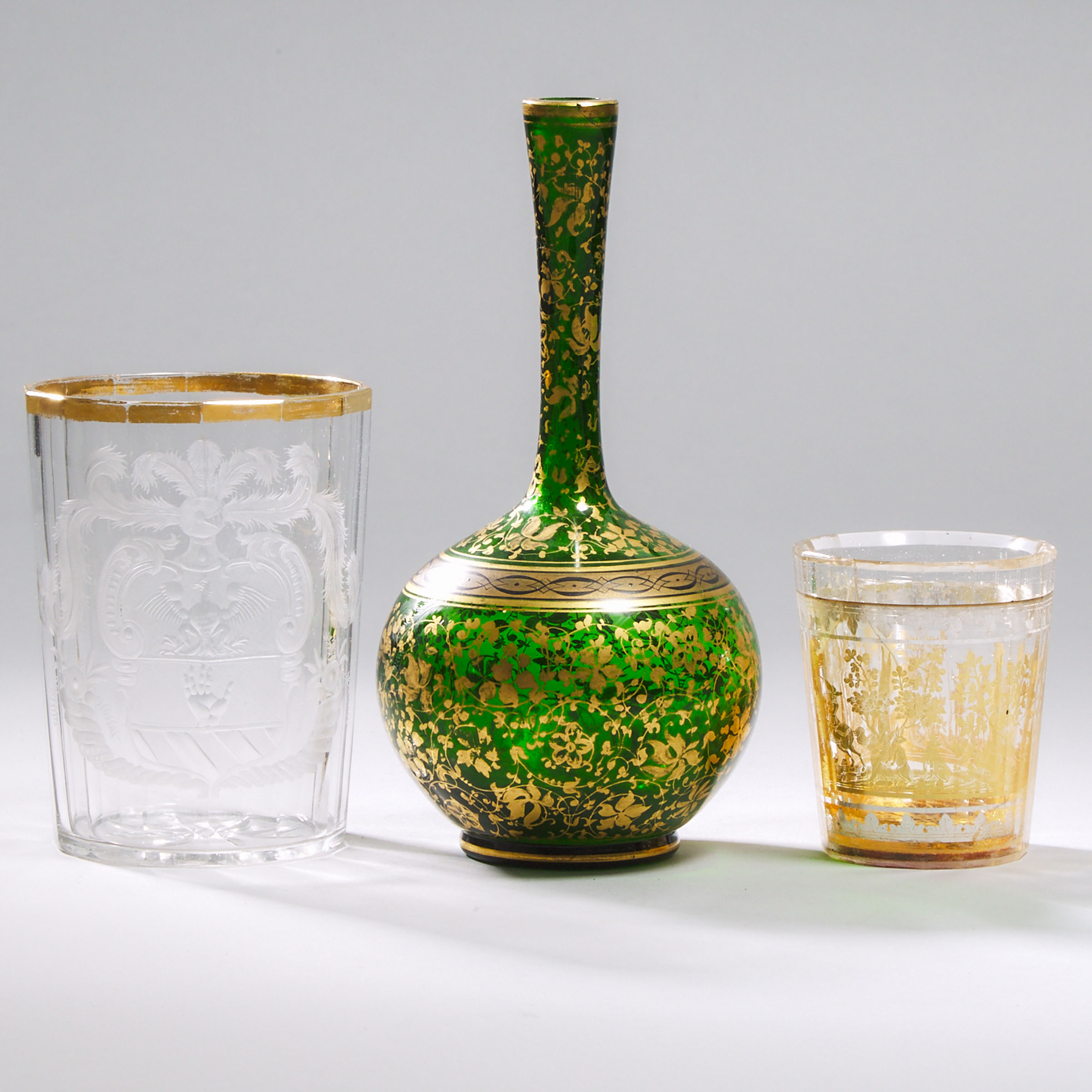 Bohemian Zwischengoldglas Small Beaker, Larger Armorial Beaker and a Gilt Green Glass Vase, 19th century