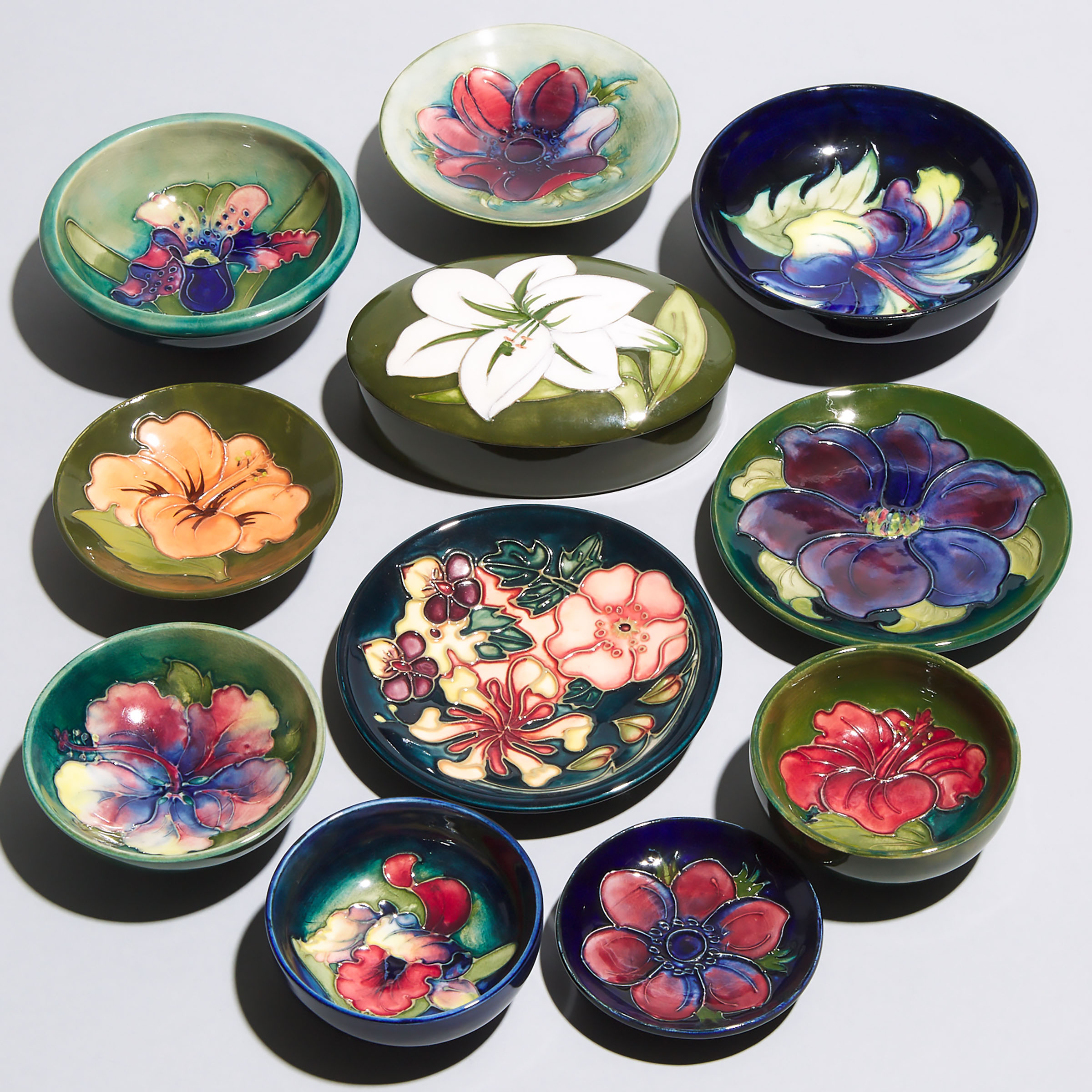 Ten Various Small Moorcroft Dishes and Bowls and an Oval Box, 20th century