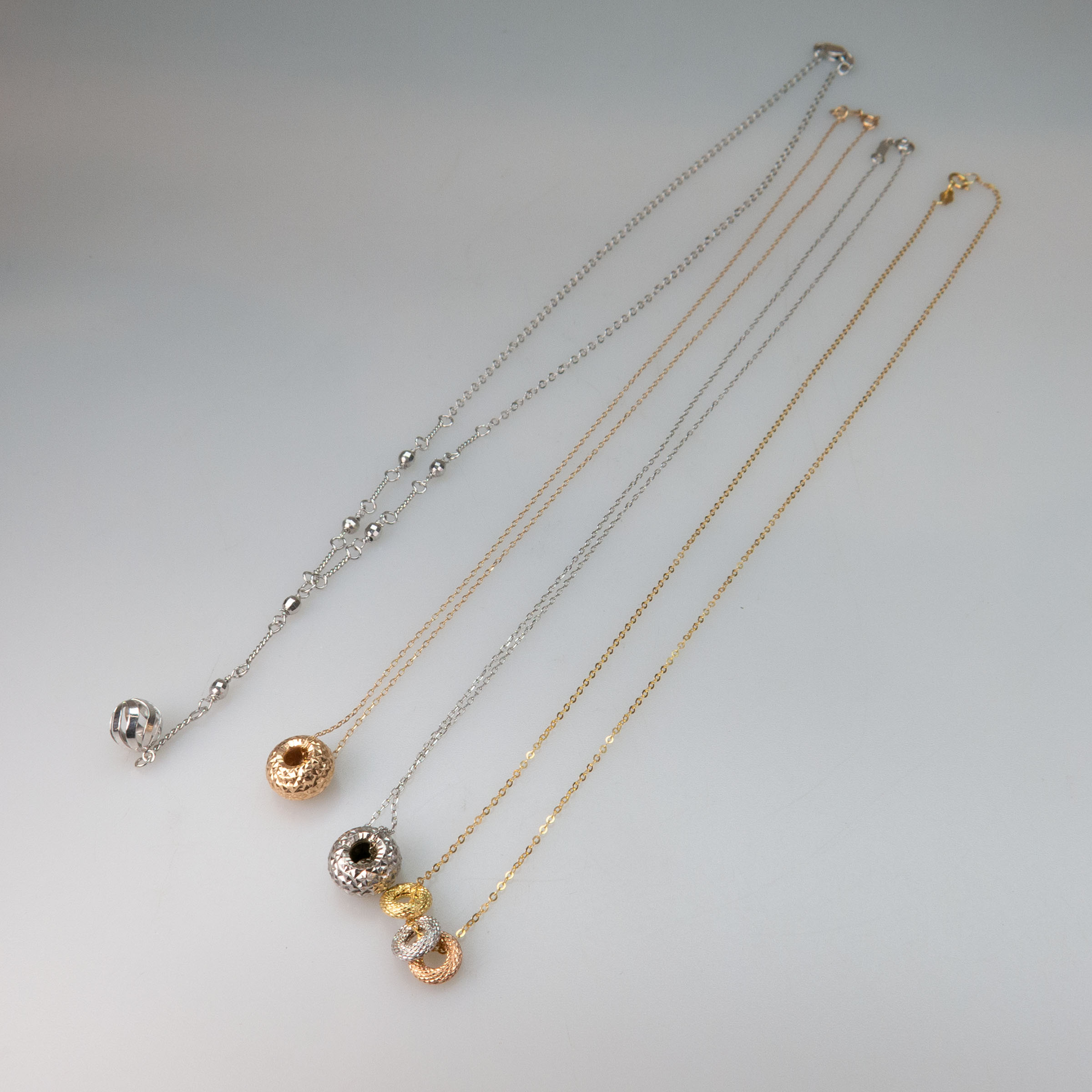 Small Group Of Gold Pendants And Chains